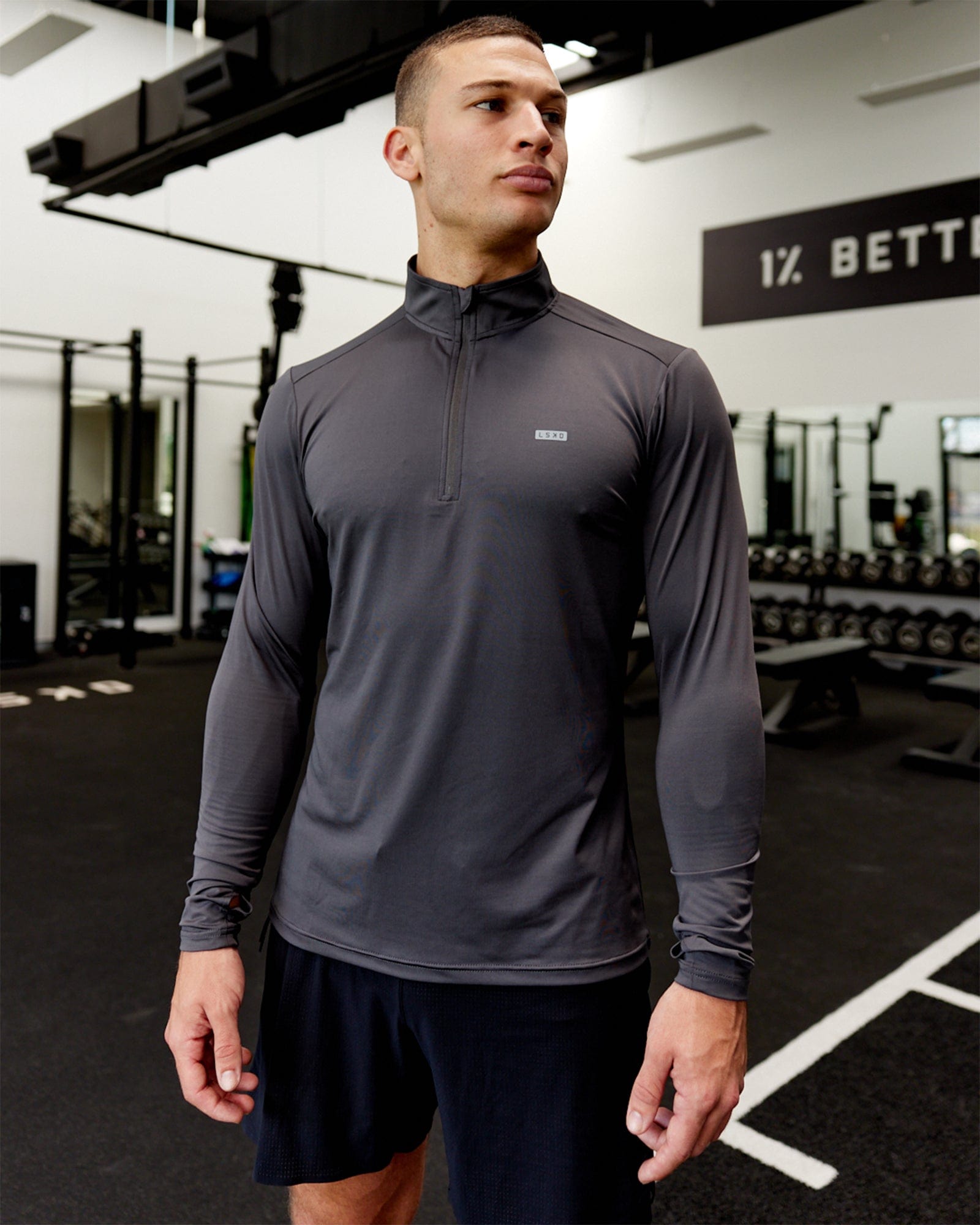 Model wearing Streamlined 1/4 Zip Active LS Top - Asphalt