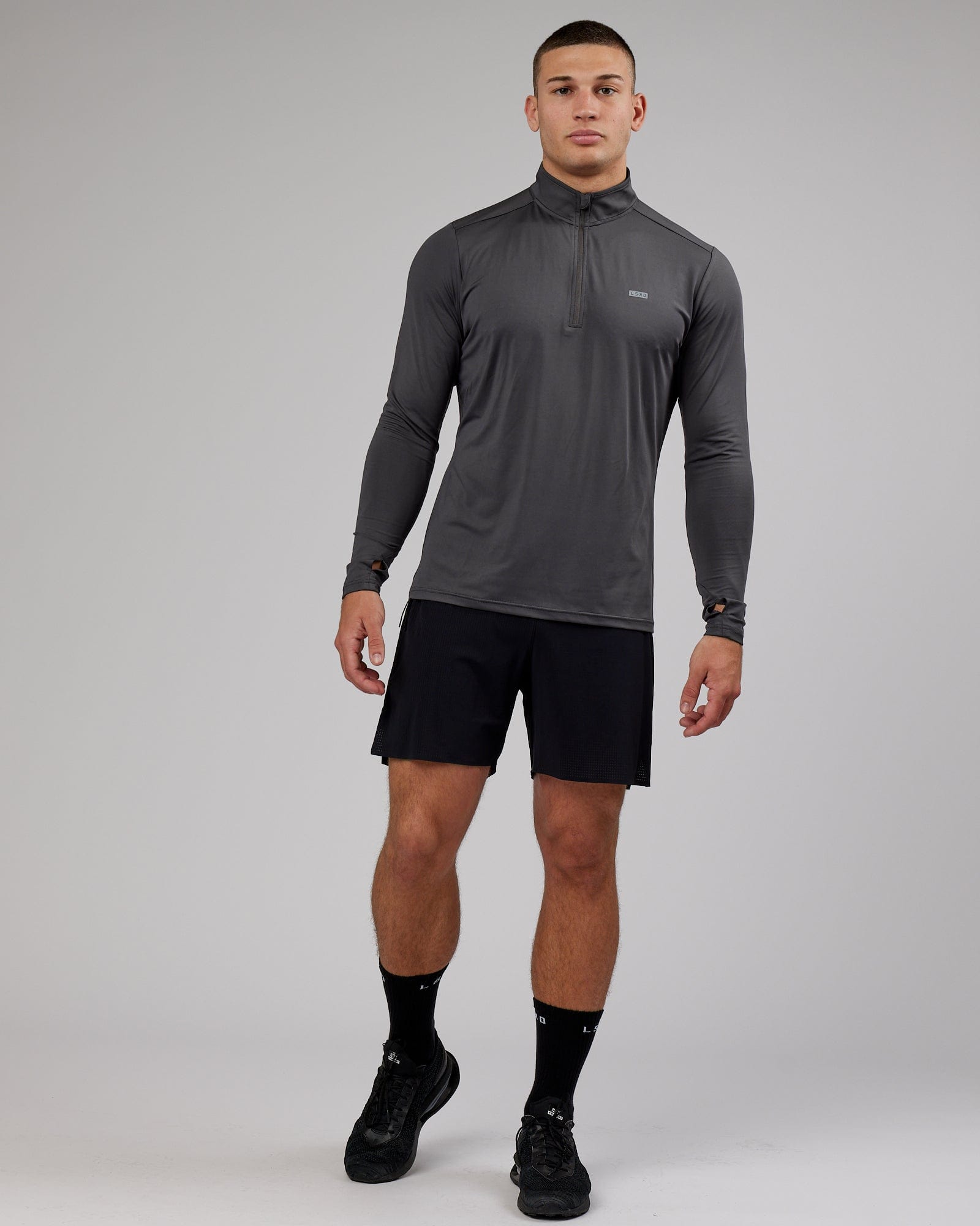 Model wearing Streamlined 1/4 Zip Active LS Top - Asphalt