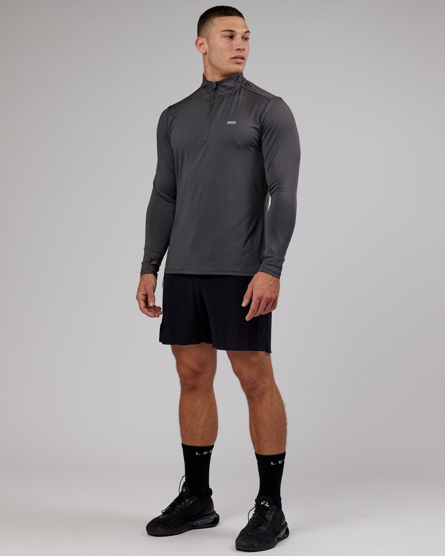 Model wearing Streamlined 1/4 Zip Active LS Top - Asphalt
