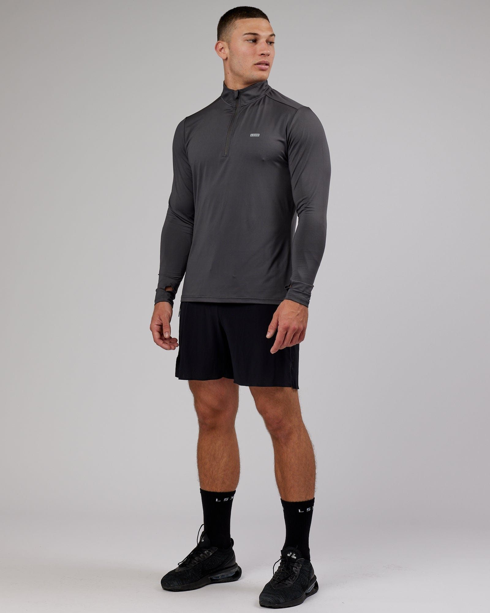 Model wearing Streamlined 1/4 Zip Active LS Top - Asphalt