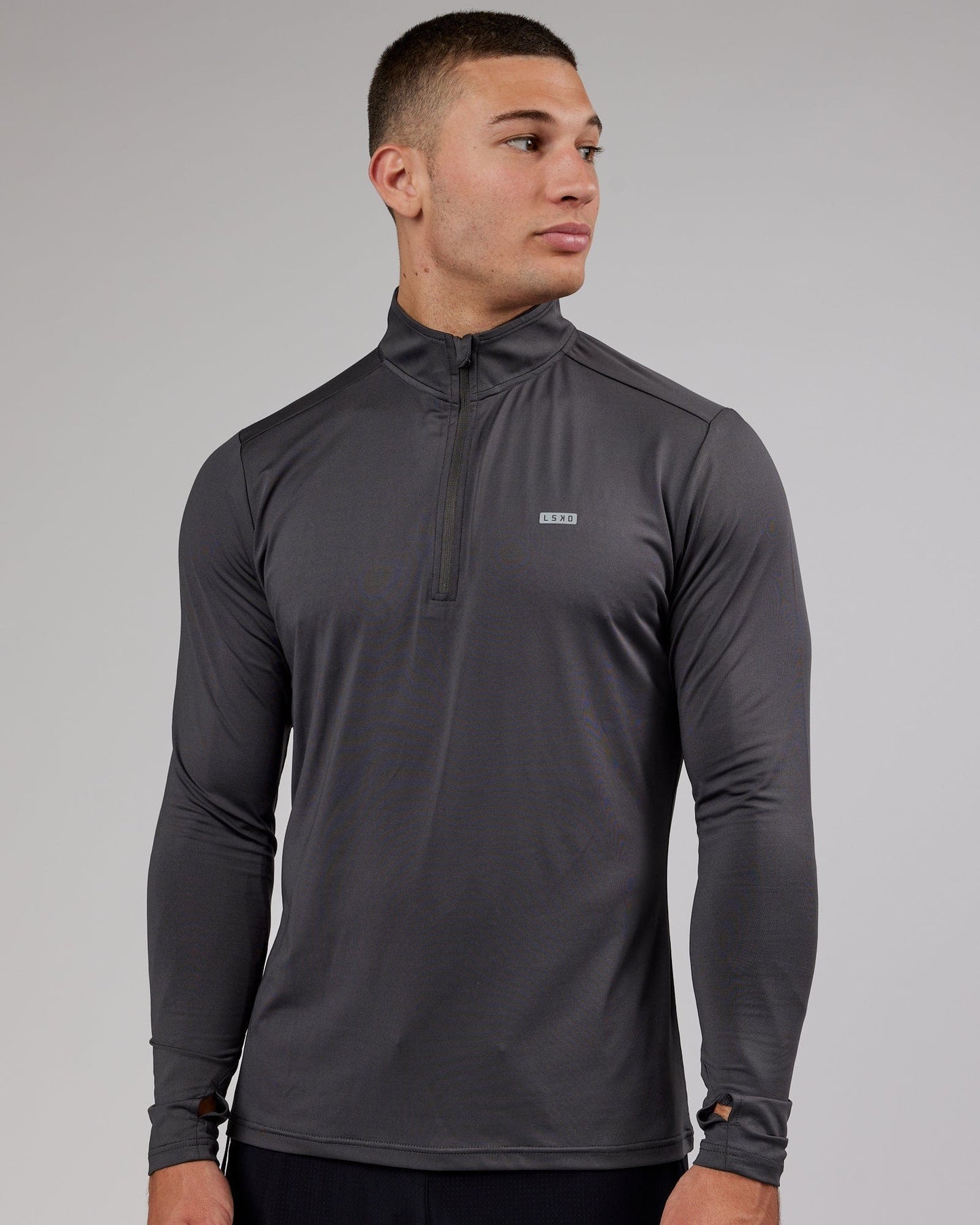 Model wearing Streamlined 1/4 Zip Active LS Top - Asphalt