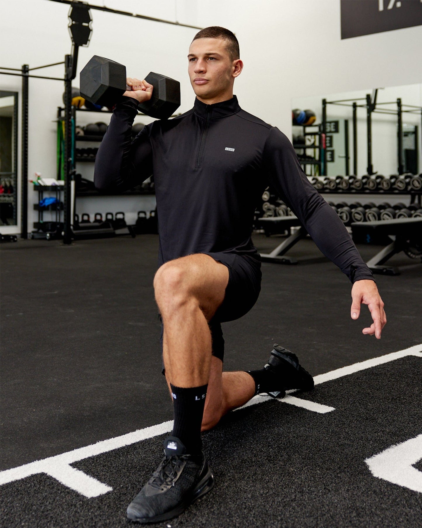 Model wearing Streamlined 1/4 Zip Active LS Top - Black