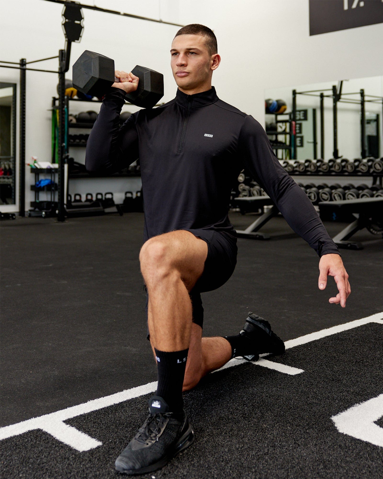 Model wearing Streamlined 1/4 Zip Active LS Top - Black