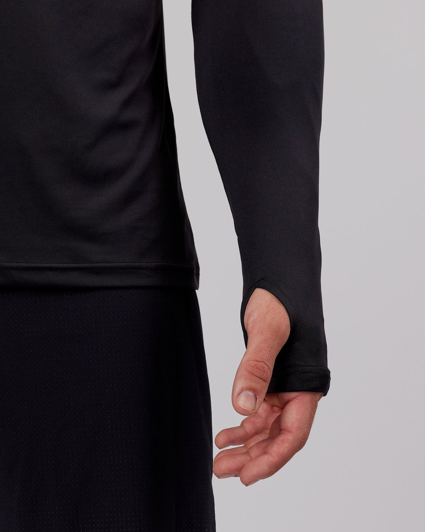 Model wearing Streamlined 1/4 Zip Active LS Top - Black