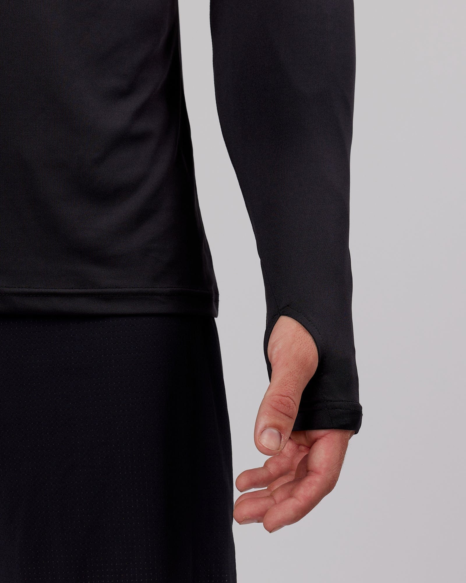 Model wearing Streamlined 1/4 Zip Active LS Top - Black