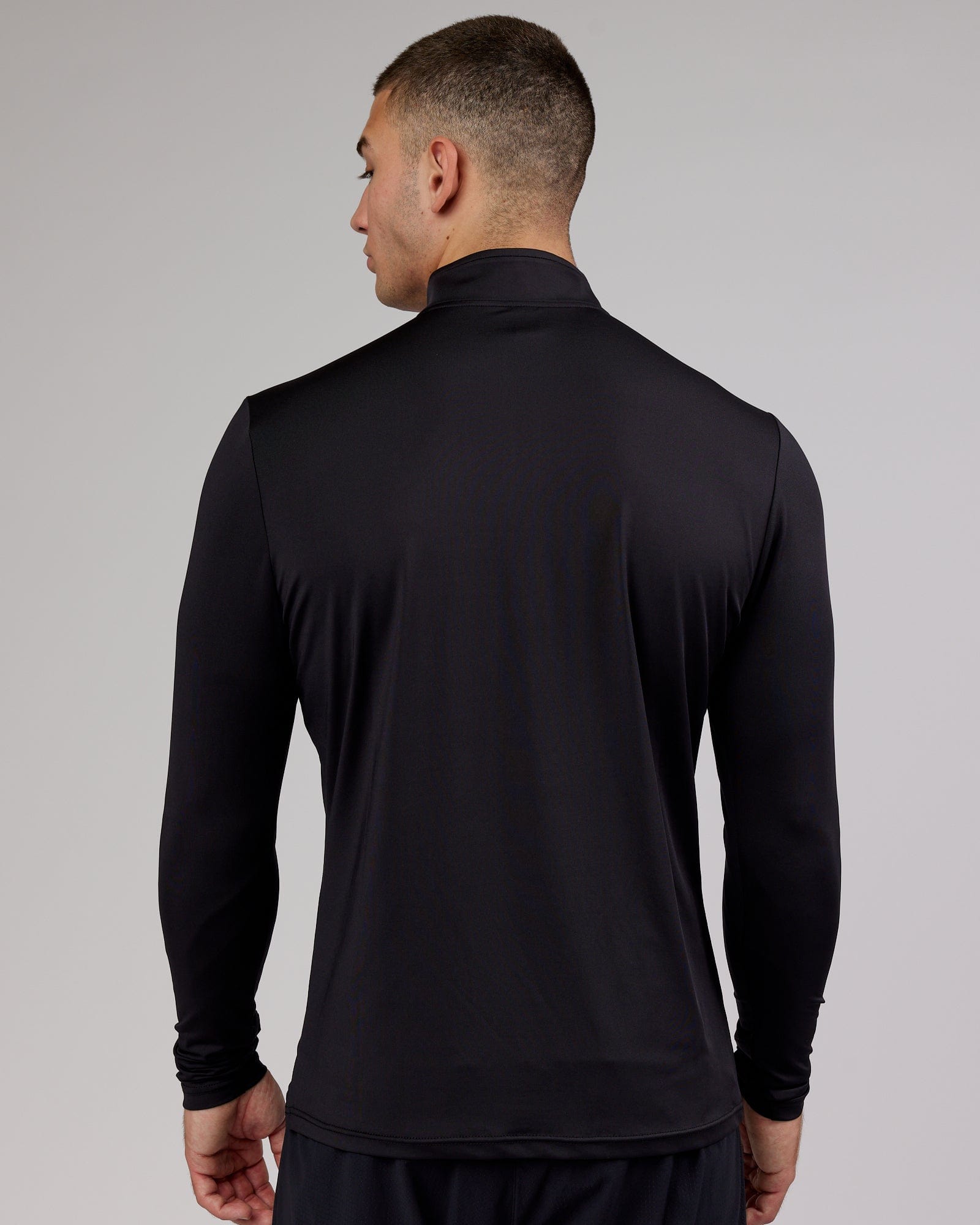 Model wearing Streamlined 1/4 Zip Active LS Top - Black