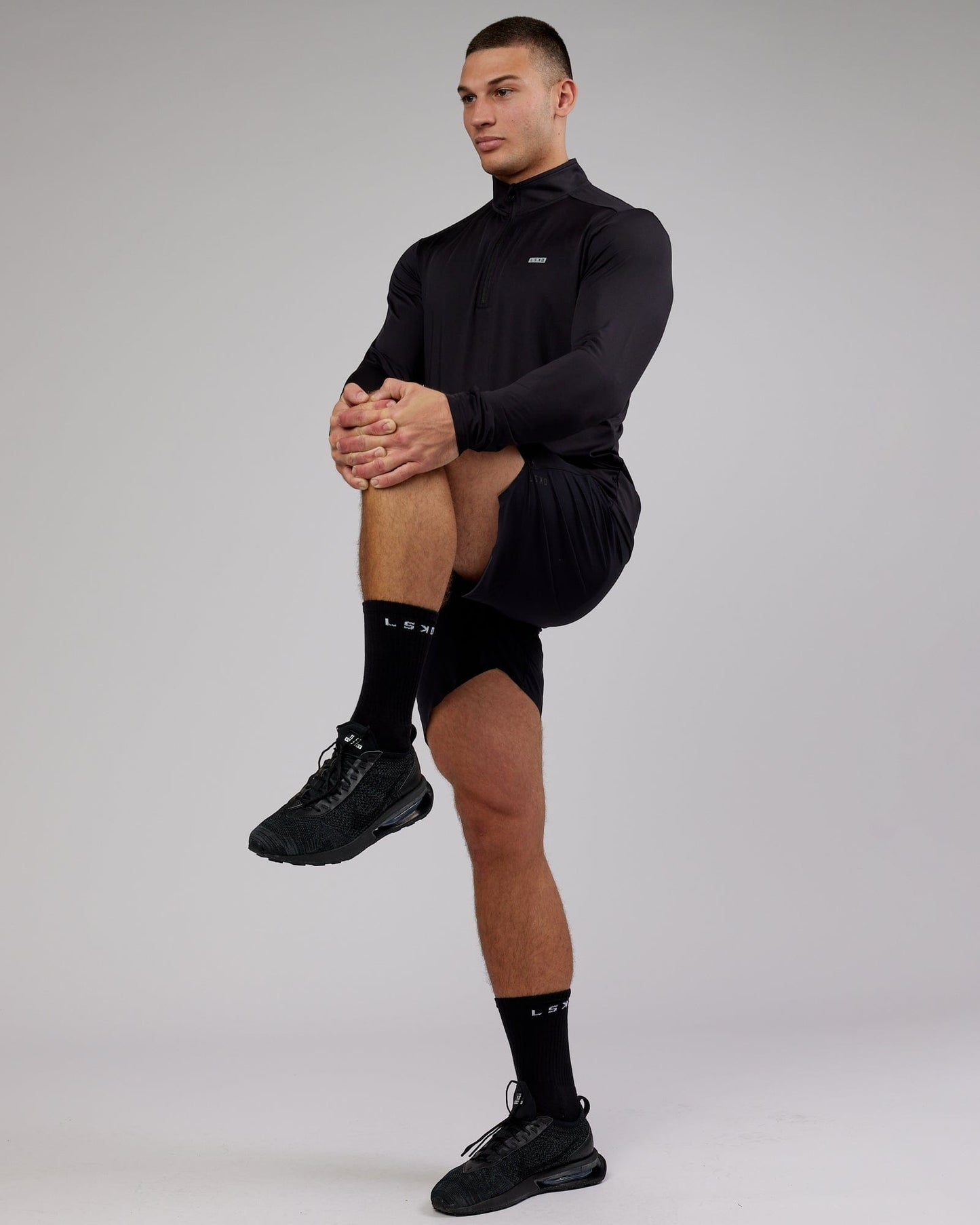 Model wearing Streamlined 1/4 Zip Active LS Top - Black