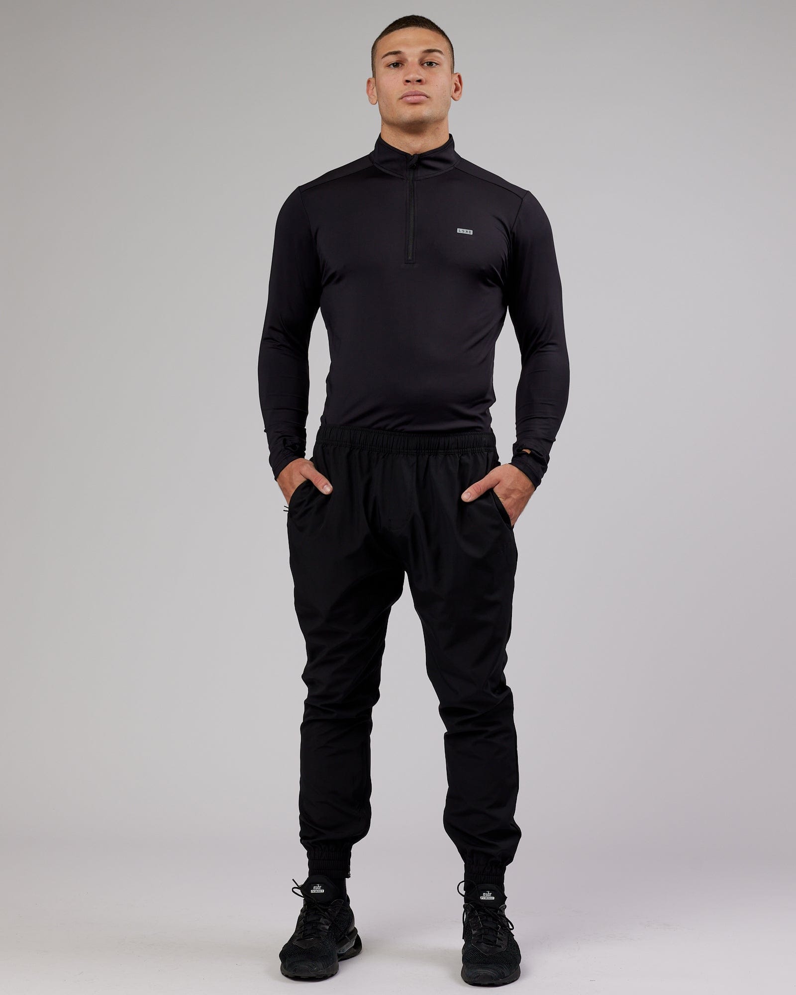 Model wearing Streamlined 1/4 Zip Active LS Top - Black