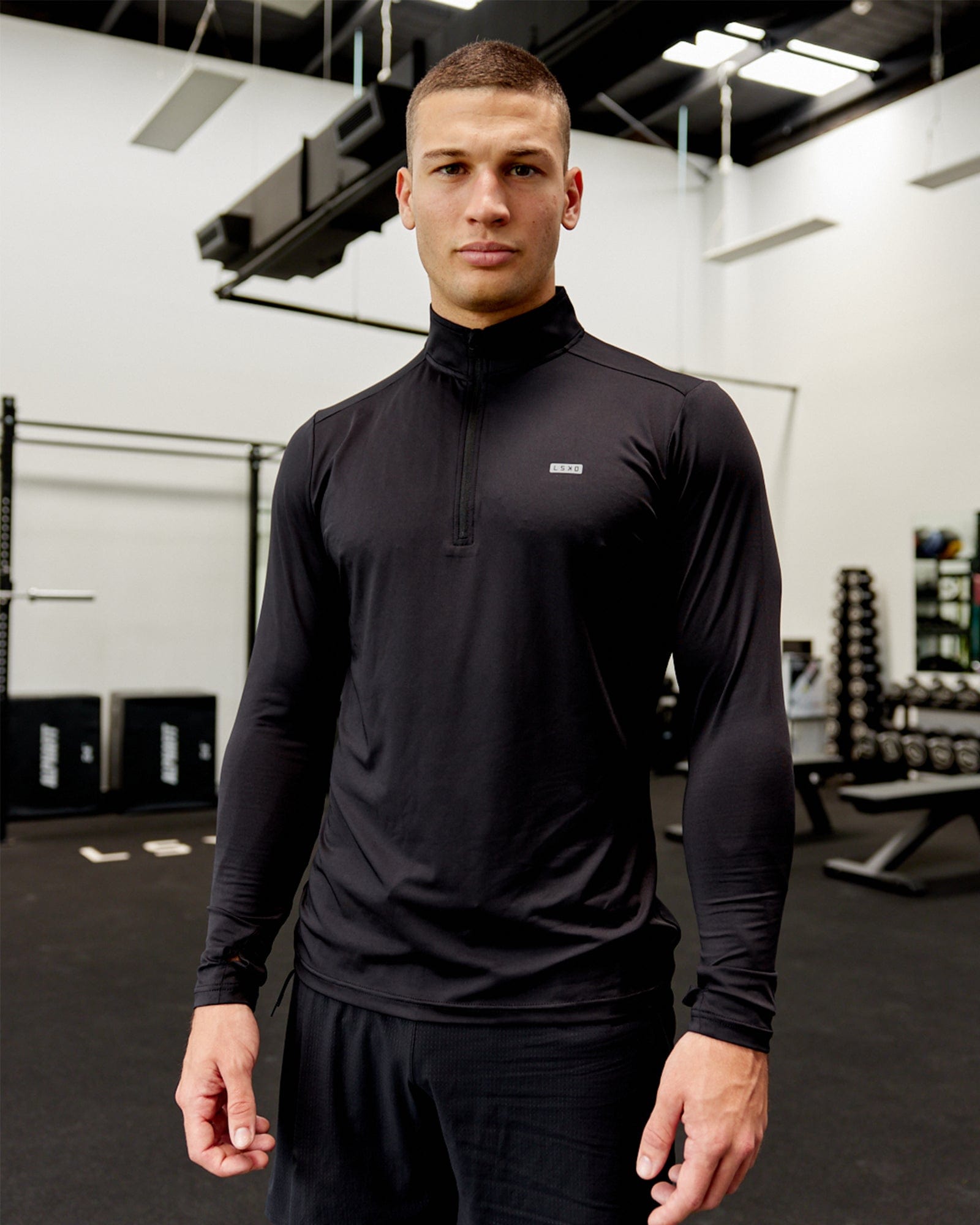 Model wearing Streamlined 1/4 Zip Active LS Top - Black