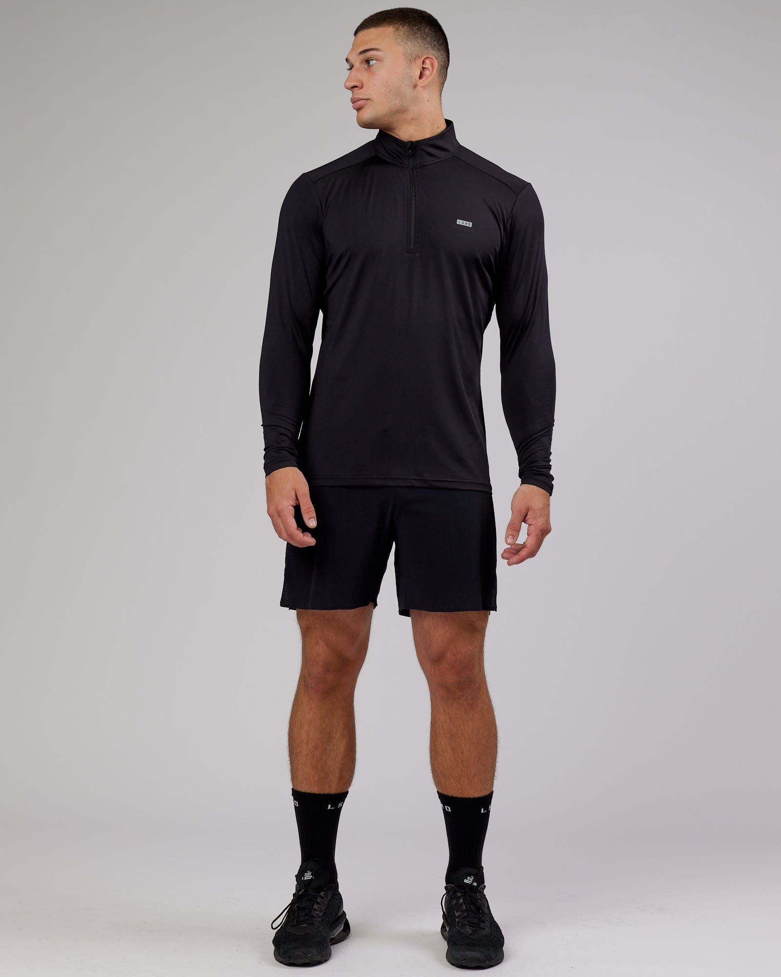 Model wearing Streamlined 1/4 Zip Active LS Top - Black