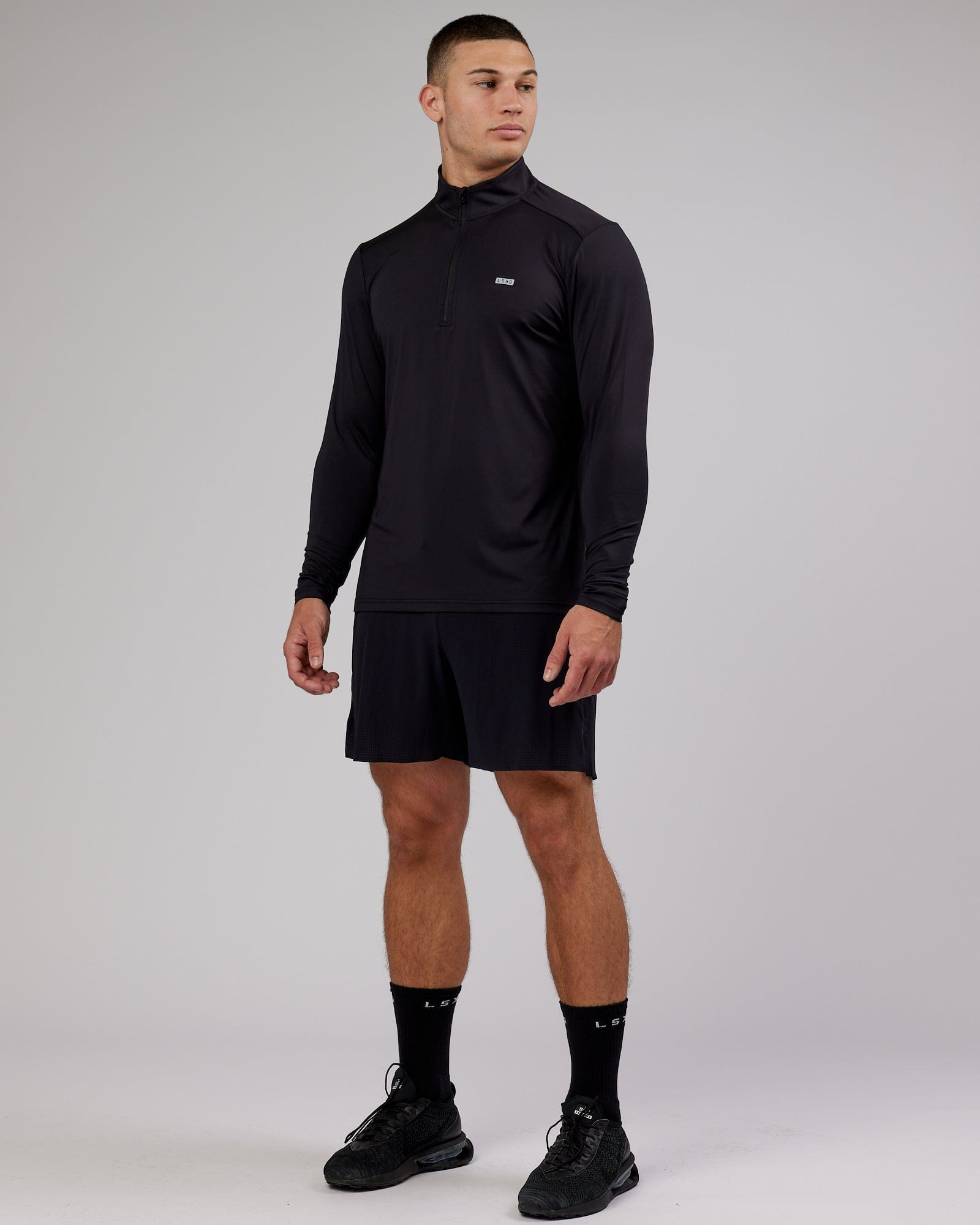 Model wearing Streamlined 1/4 Zip Active LS Top - Black