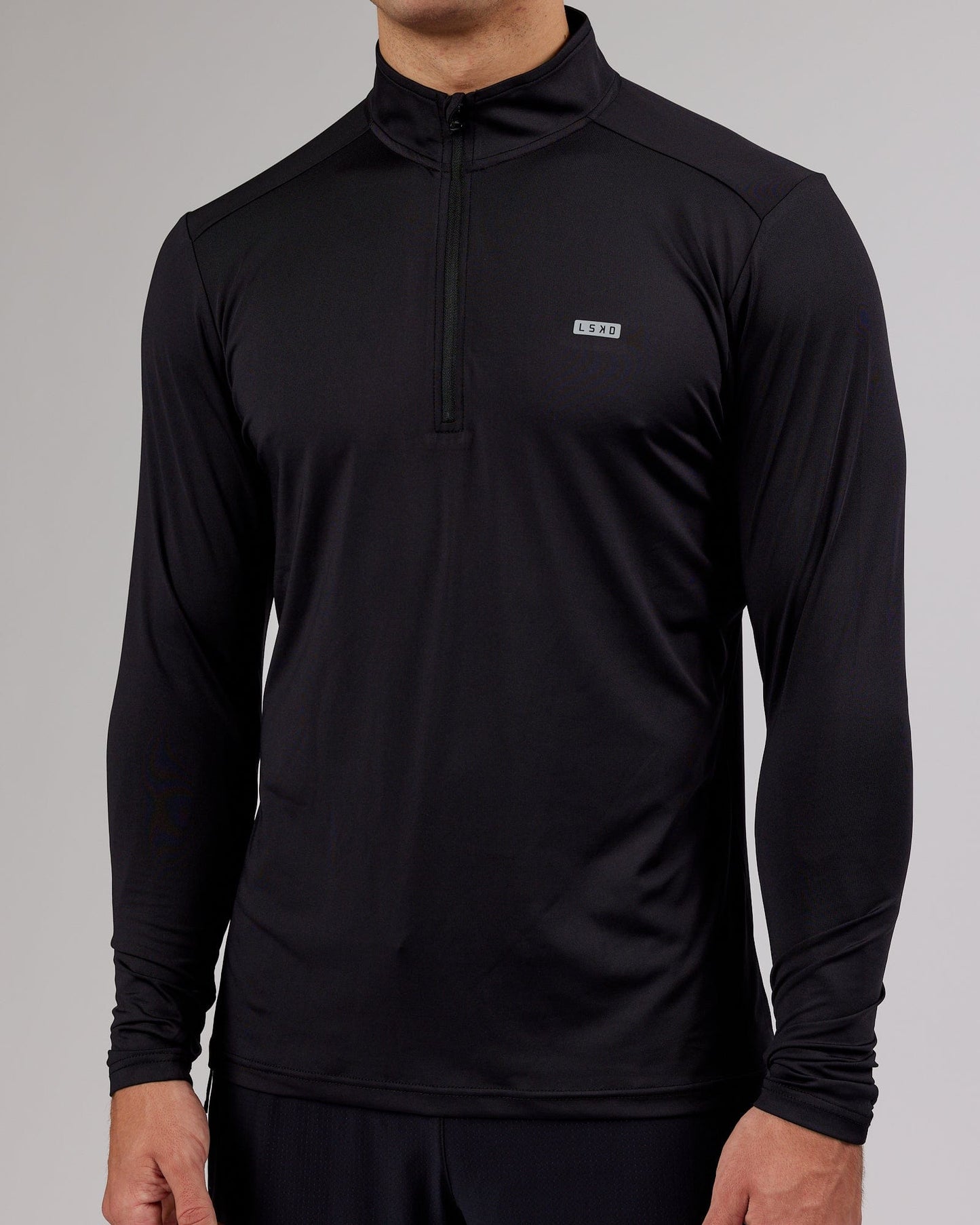 Model wearing Streamlined 1/4 Zip Active LS Top - Black
