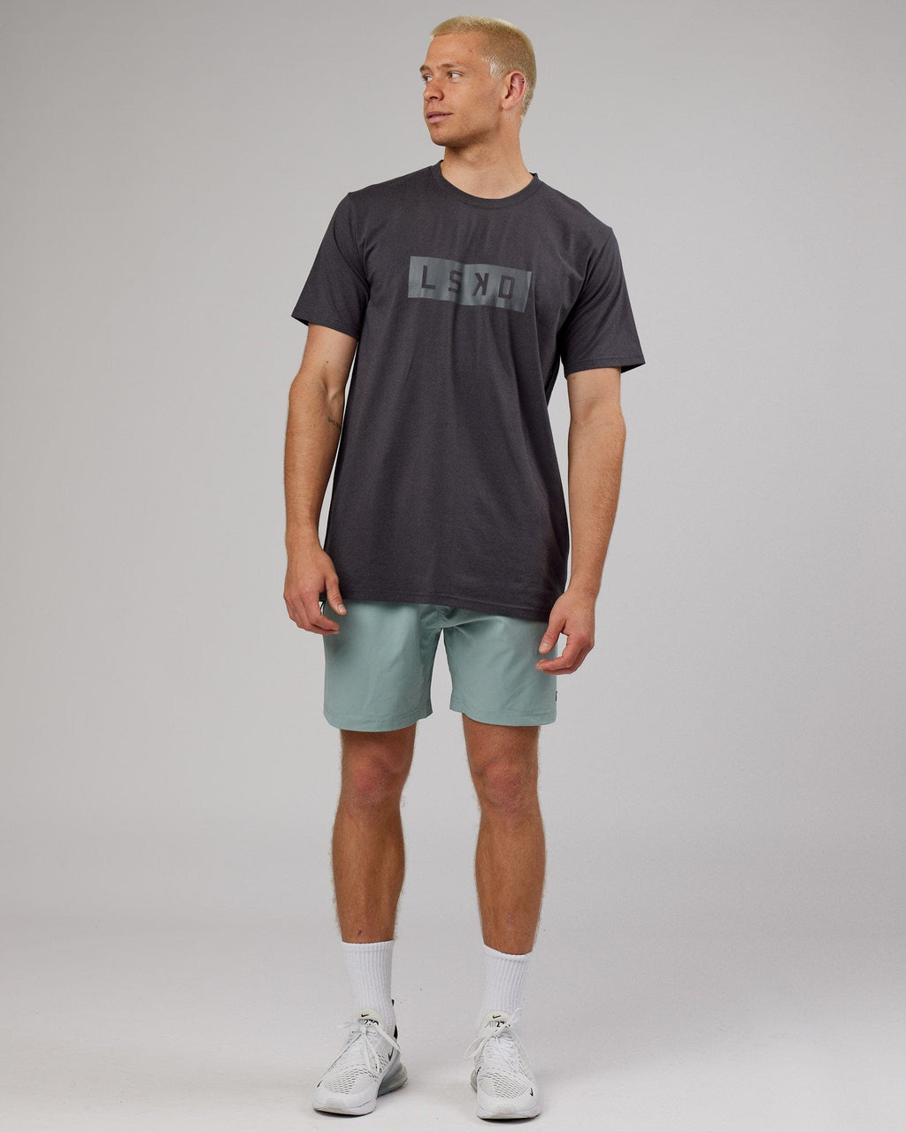 Model wearing Strength FLXDRY Performance Tee - Asphalt