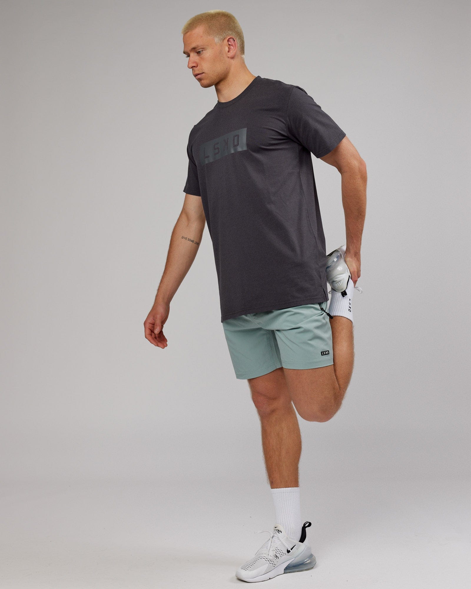 Model wearing Strength FLXDRY Performance Tee - Asphalt