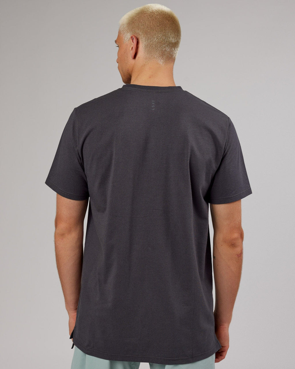 Model wearing Strength FLXDRY Performance Tee - Asphalt