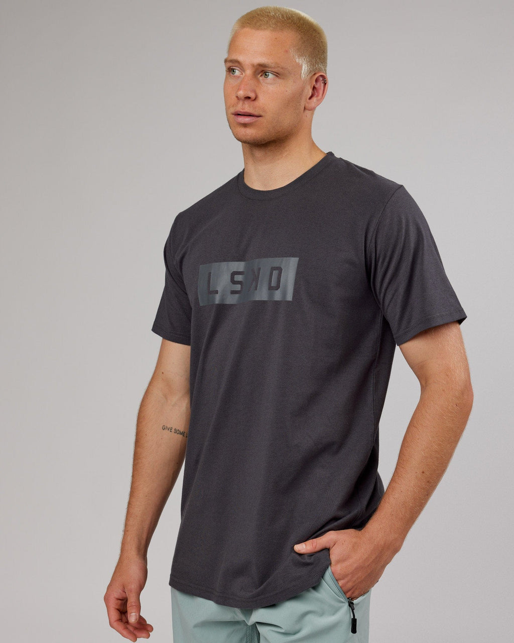 Model wearing Strength FLXDRY Performance Tee - Asphalt