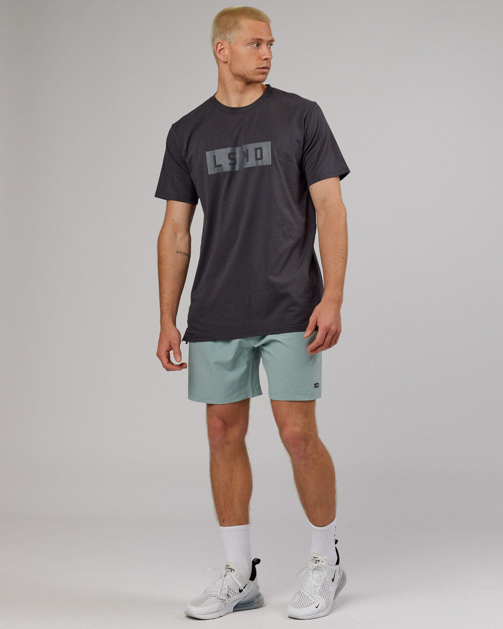 Model wearing Strength FLXDRY Performance Tee - Asphalt