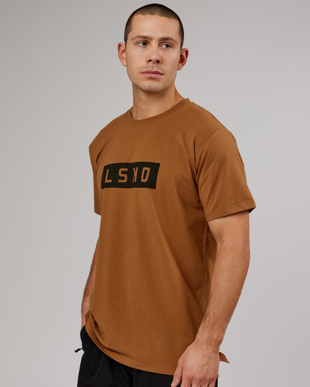 Model wearing Strength FLXDRY Performance Tee - Camel