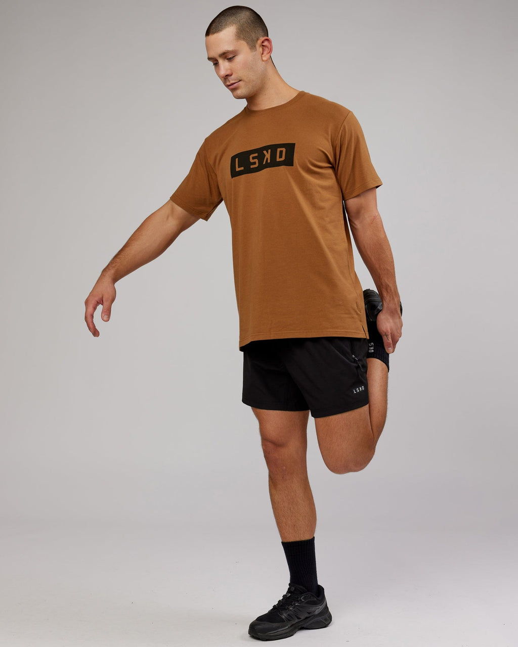 Model wearing Strength FLXDRY Performance Tee - Camel