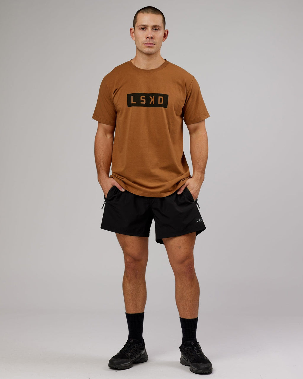 Model wearing Strength FLXDRY Performance Tee - Camel