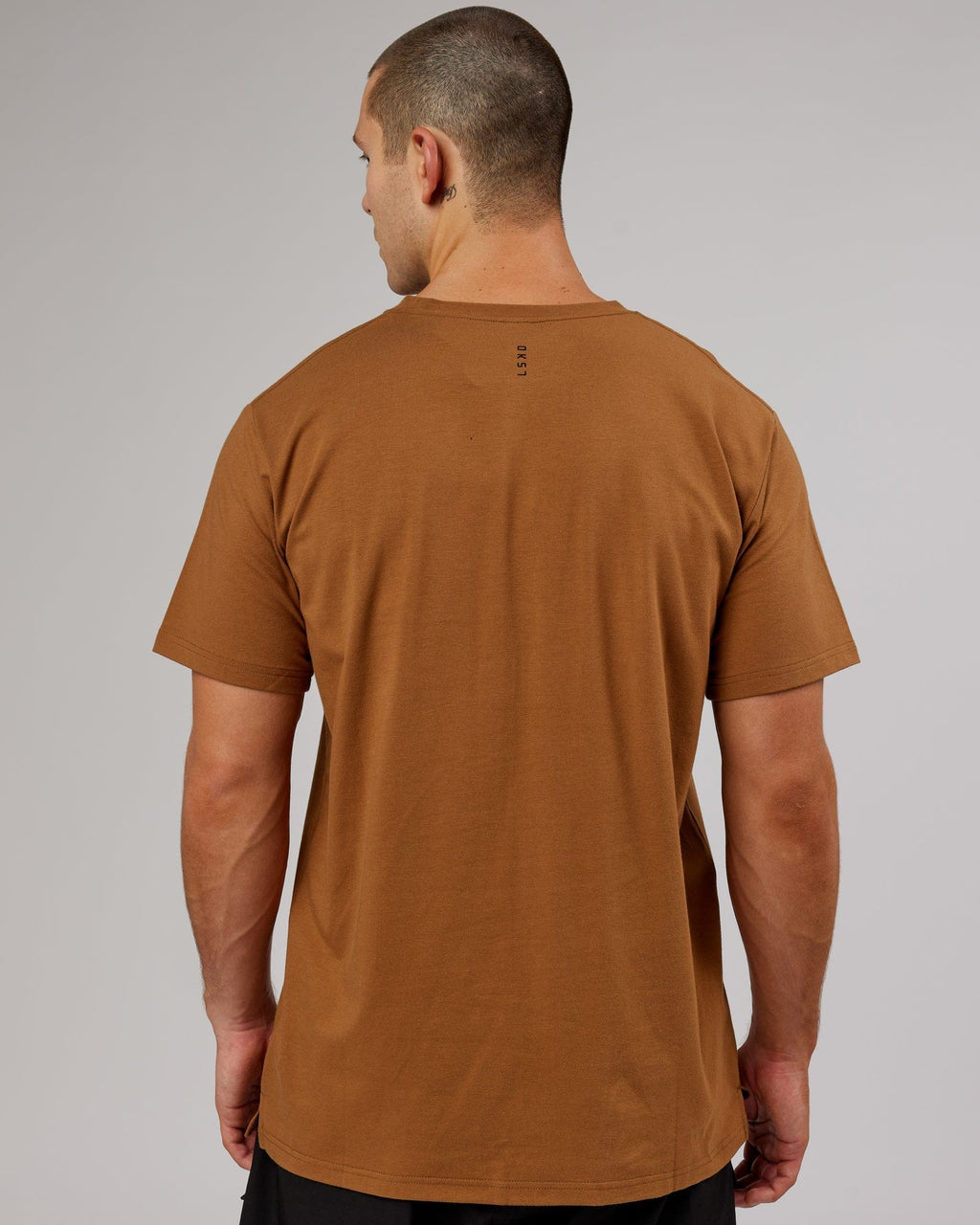 Model wearing Strength FLXDRY Performance Tee - Camel