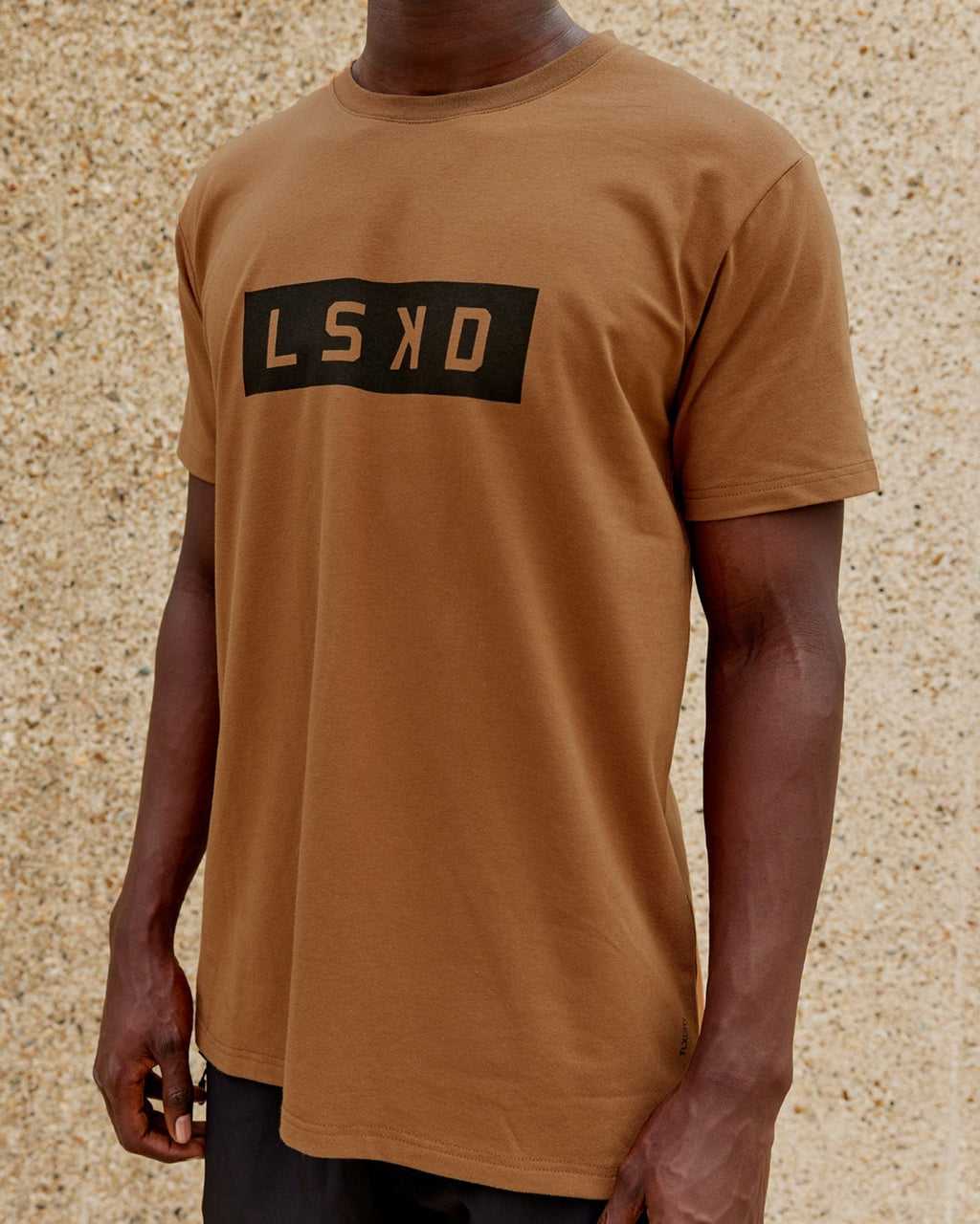 Model wearing Strength FLXDRY Performance Tee - Camel
