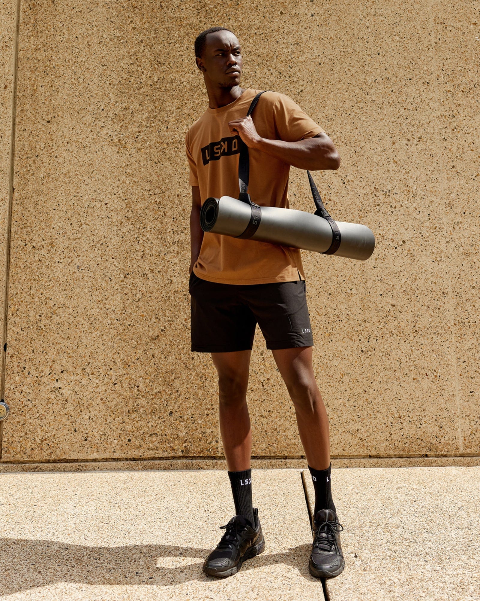 Model wearing Strength FLXDRY Performance Tee - Camel