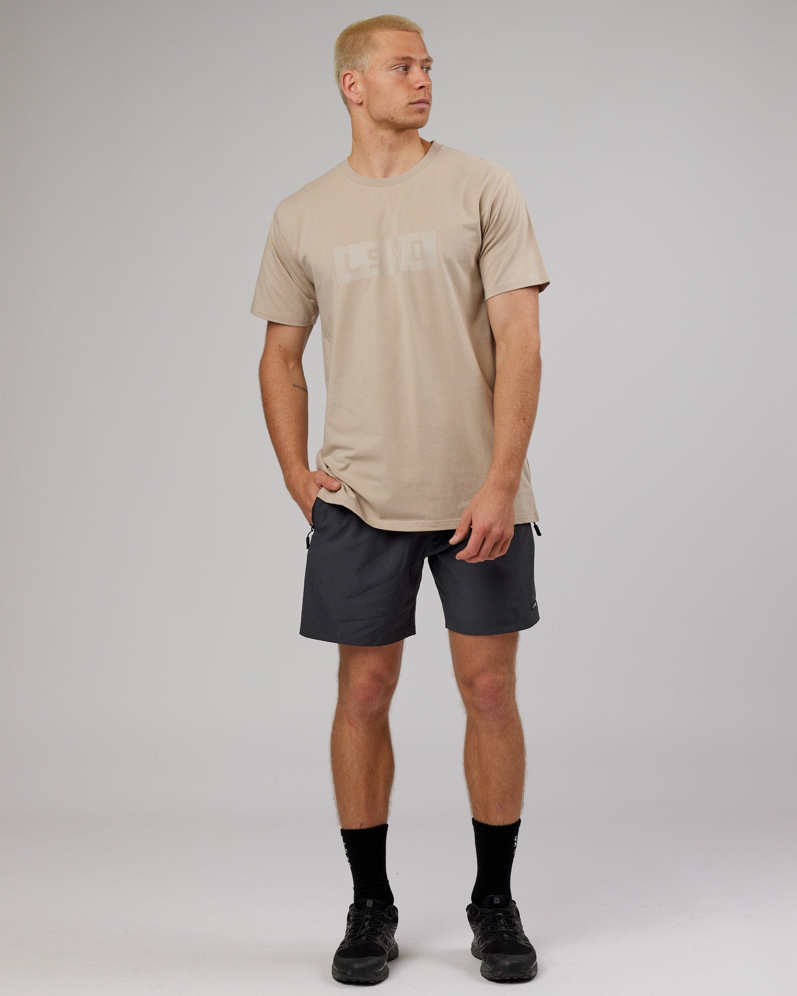 Model wearing Strength FLXDRY Performance Tee - Taupe