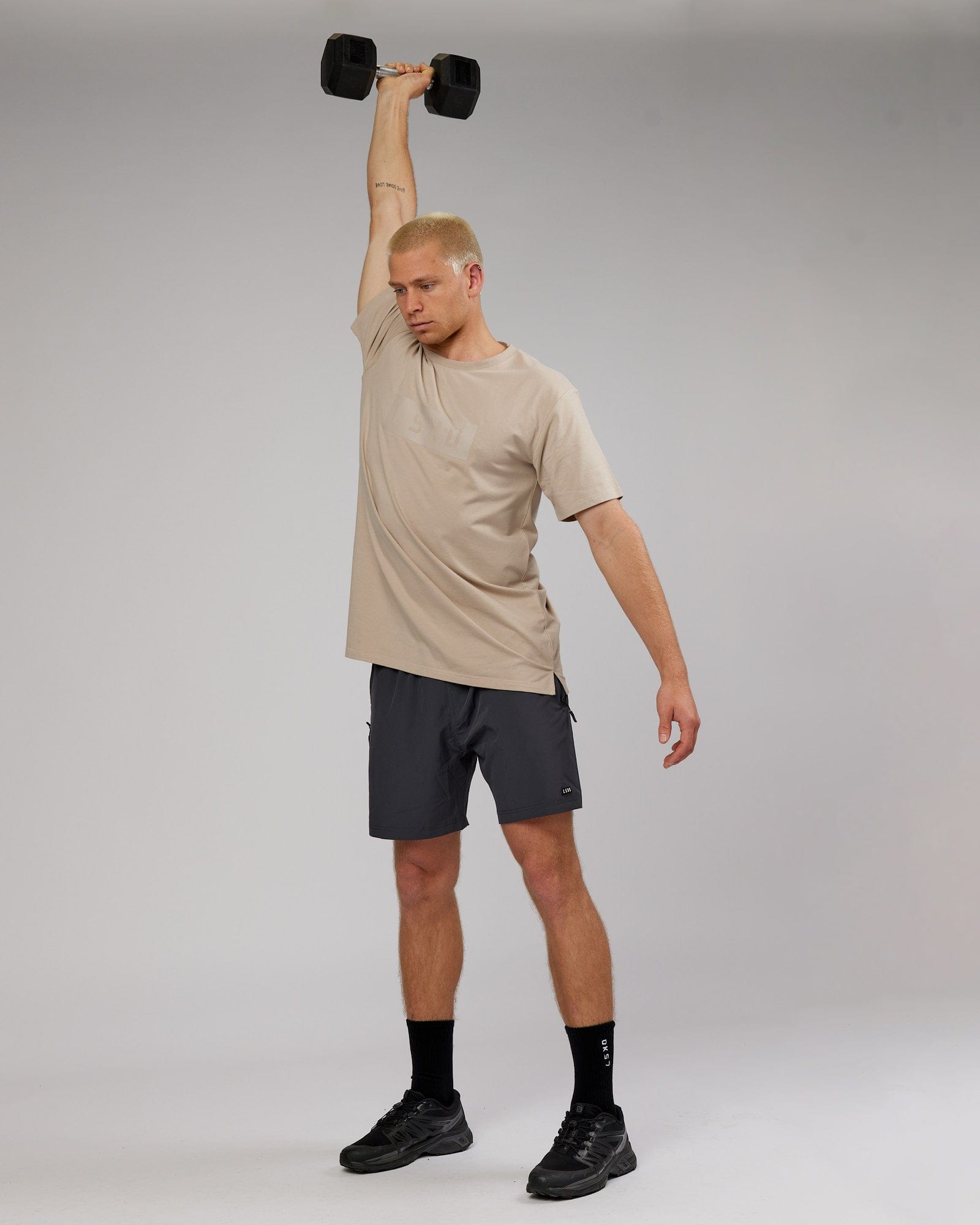 Model wearing Strength FLXDRY Performance Tee - Taupe