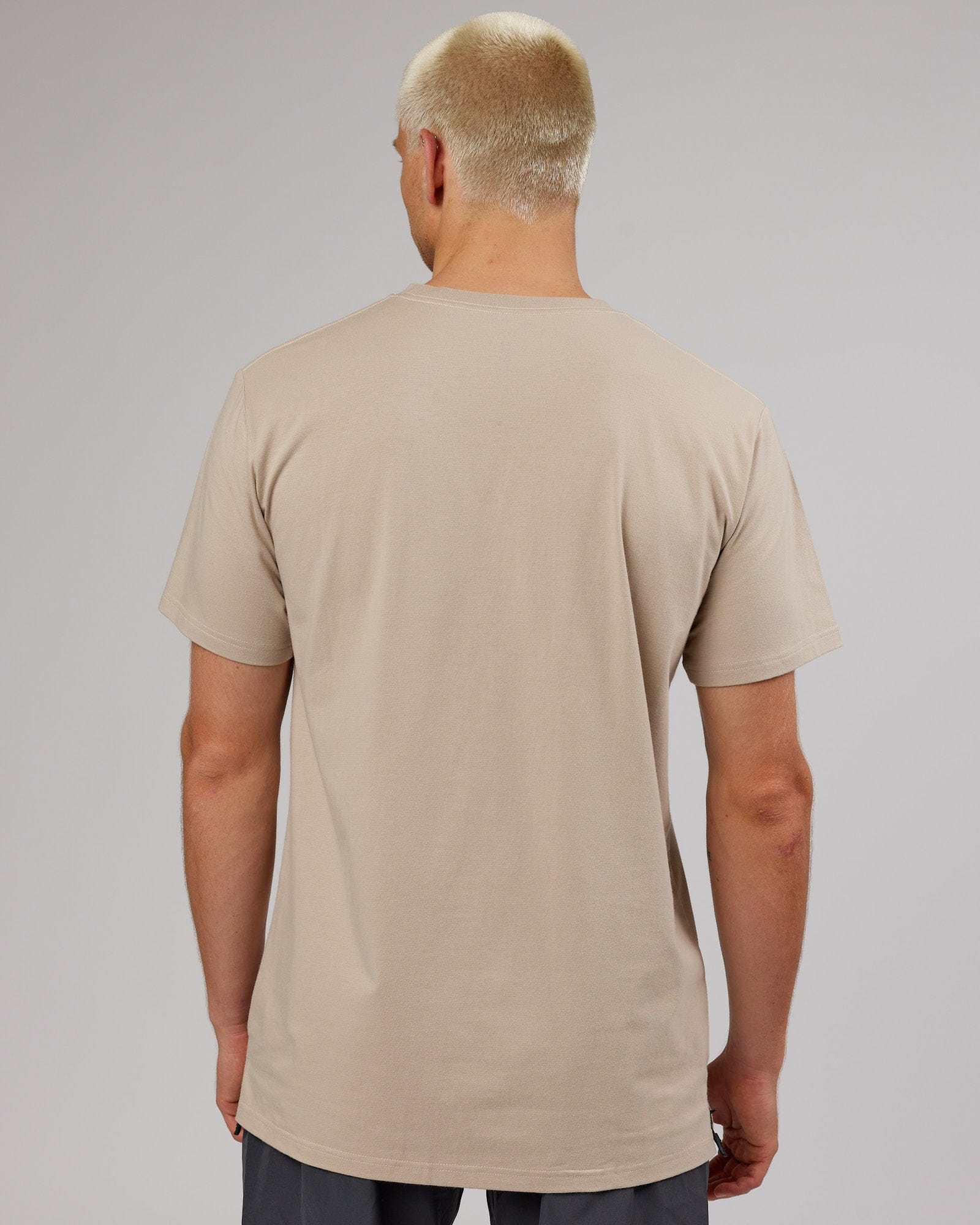 Model wearing Strength FLXDRY Performance Tee - Taupe