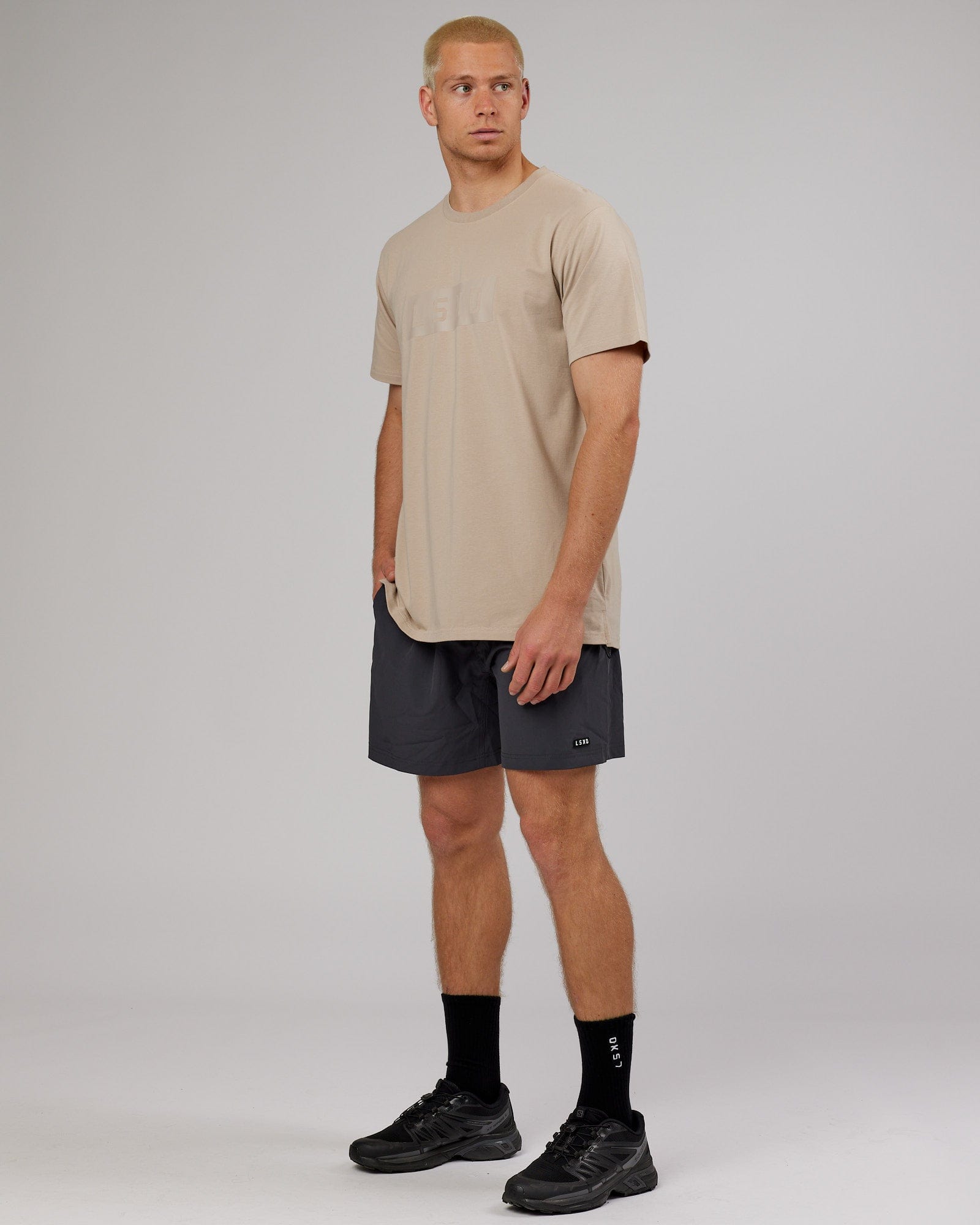 Model wearing Strength FLXDRY Performance Tee - Taupe