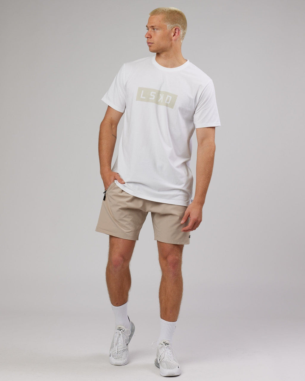 Model wearing Strength FLXDRY Performance Tee - White-Taupe