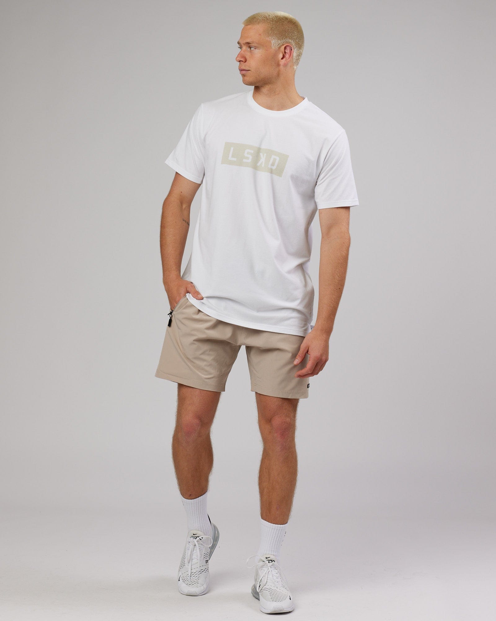 Model wearing Strength FLXDRY Performance Tee - White-Taupe