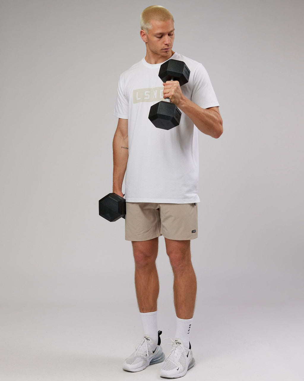 Model wearing Strength FLXDRY Performance Tee - White-Taupe