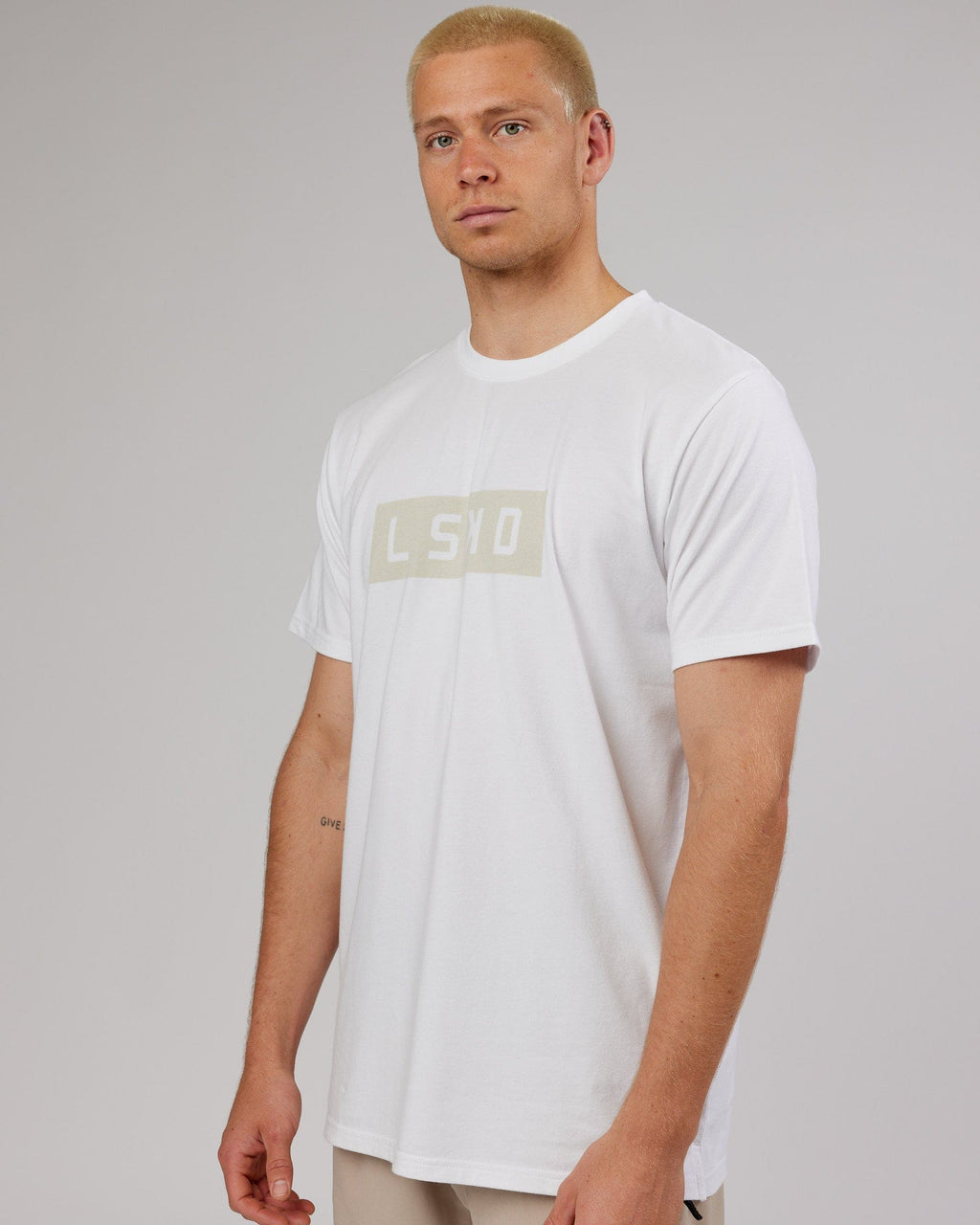 Model wearing Strength FLXDRY Performance Tee - White-Taupe
