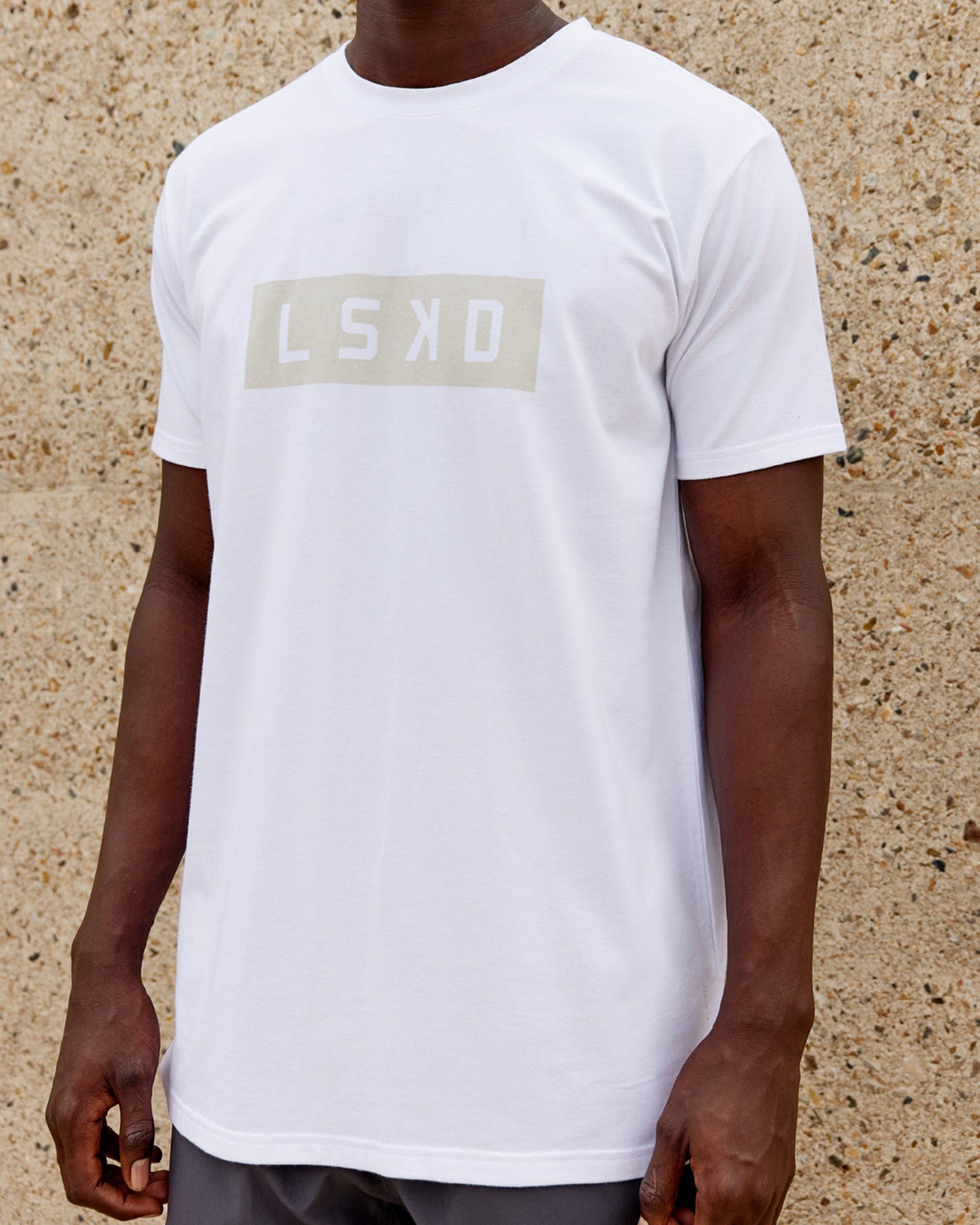 Model wearing Strength FLXDRY Performance Tee - White-Taupe