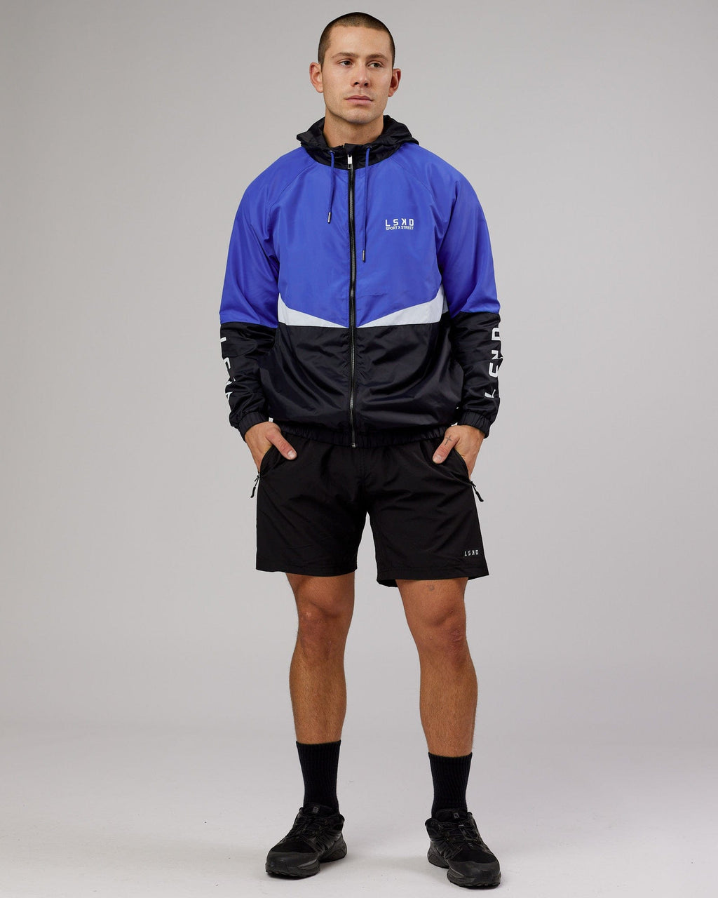 Model wearing Trackside Jacket - Power Cobalt