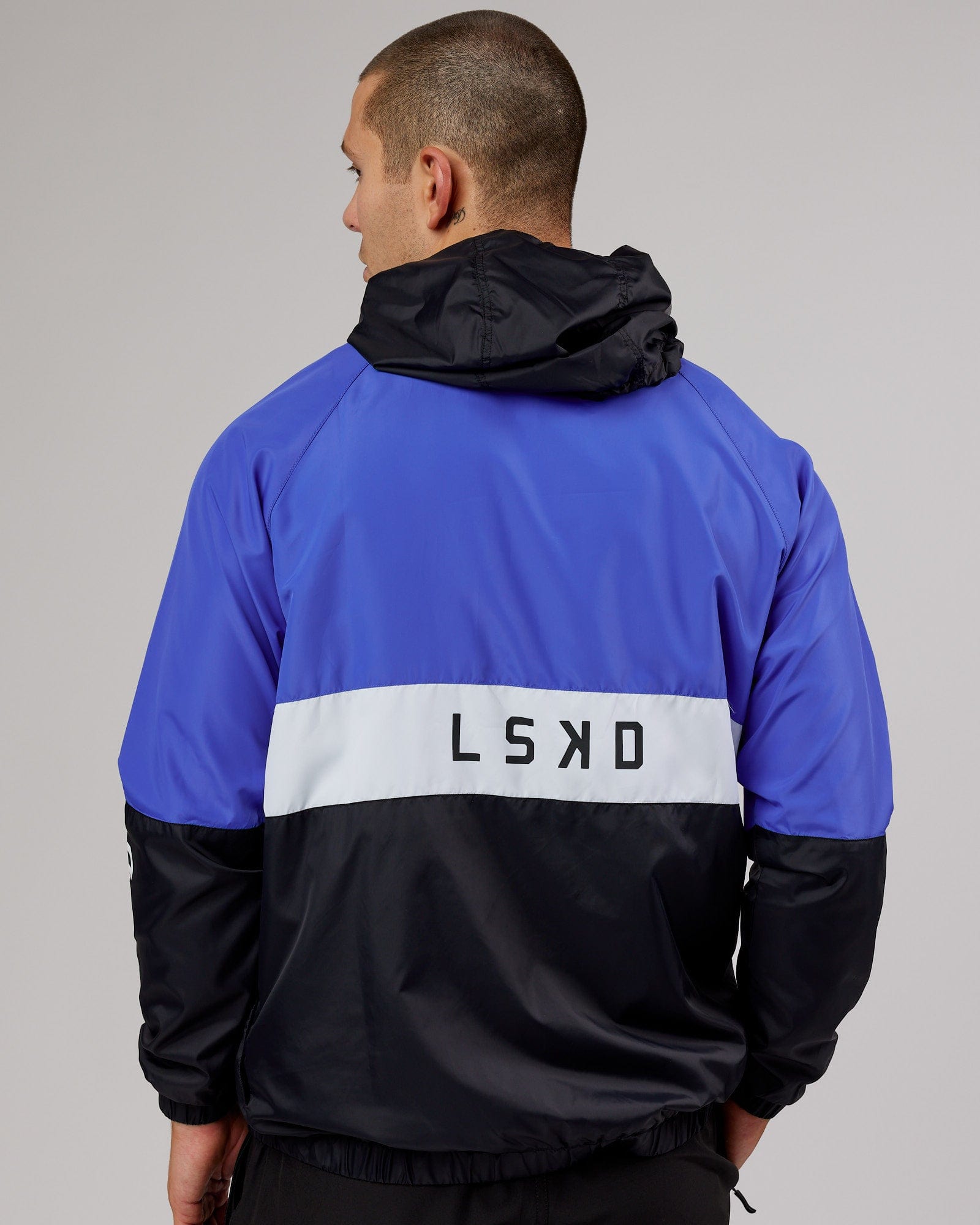 Model wearing Trackside Jacket - Power Cobalt