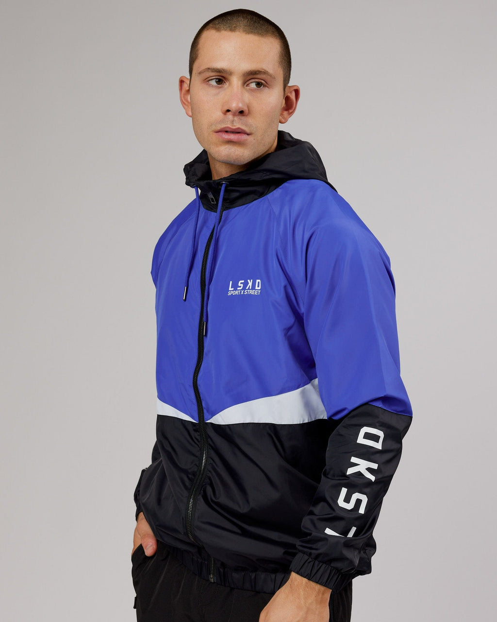 Model wearing Trackside Jacket - Power Cobalt