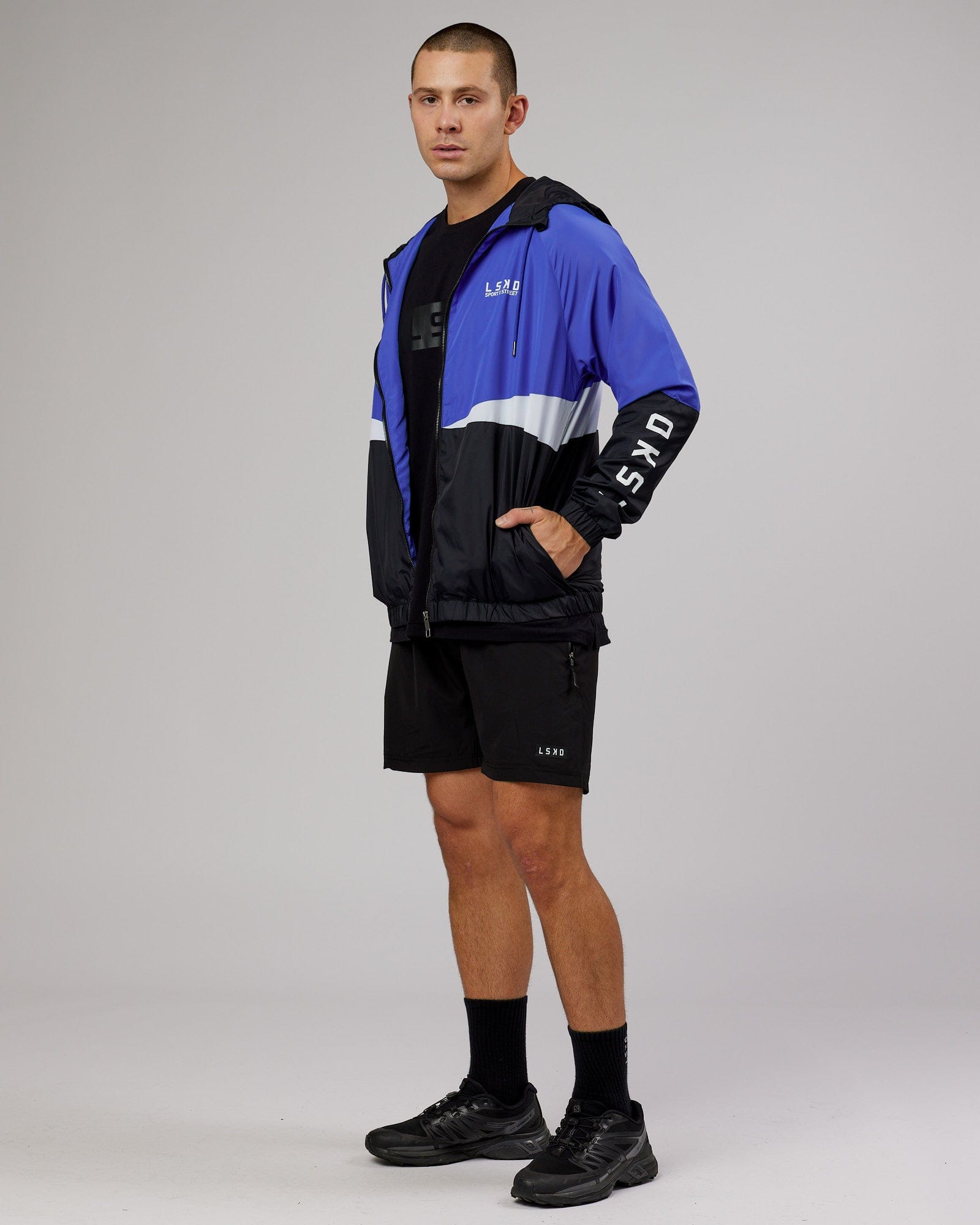 Model wearing Trackside Jacket - Power Cobalt