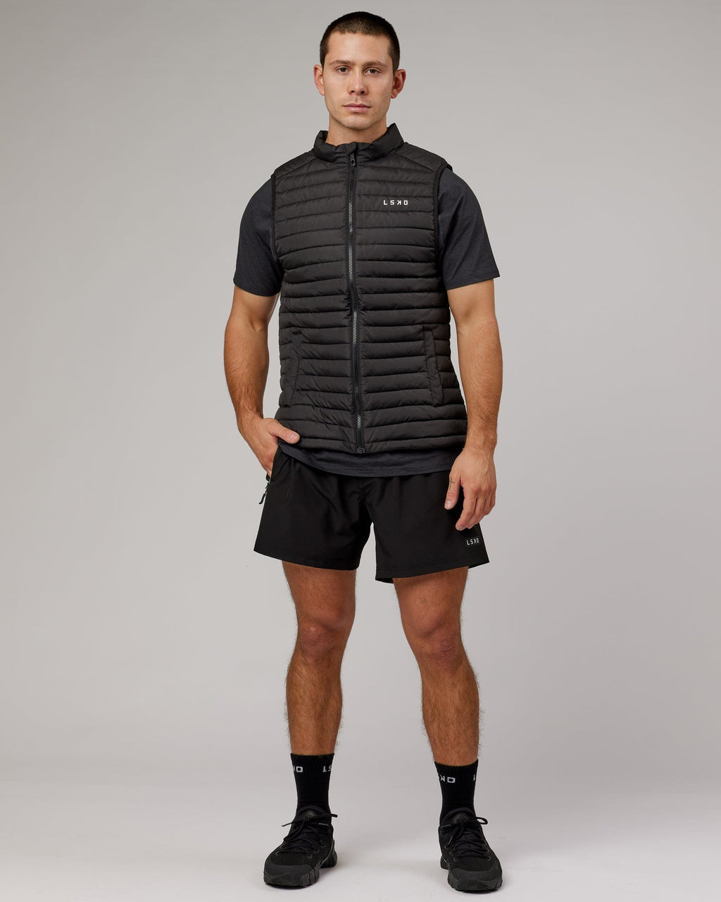 Model wearing Uplift Puffer Vest - Black Fade