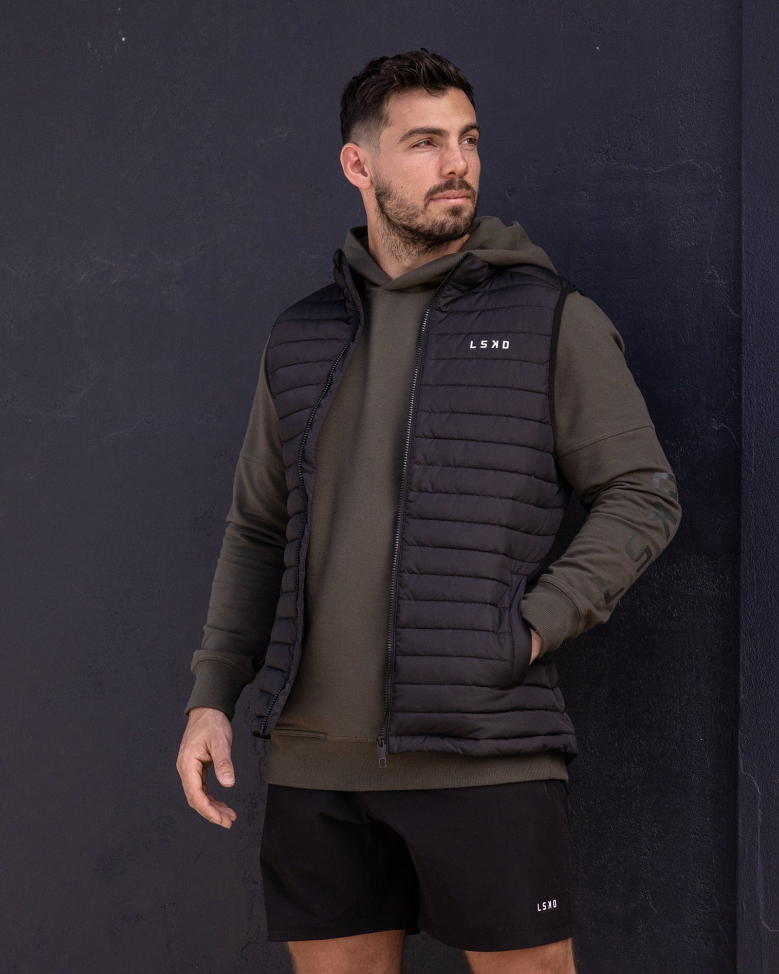 Model wearing Uplift Puffer Vest - Black Fade