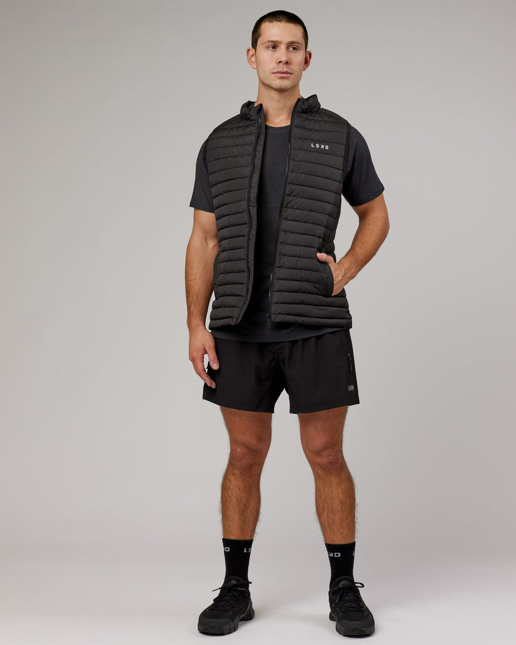 Model wearing Uplift Puffer Vest - Black Fade