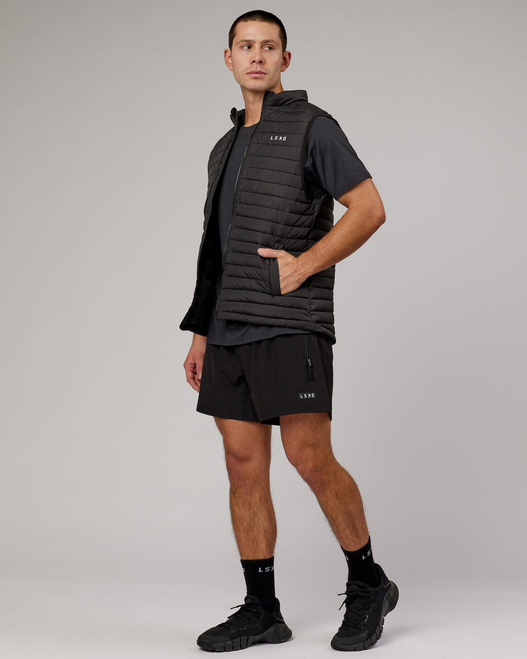 Model wearing Uplift Puffer Vest - Black Fade