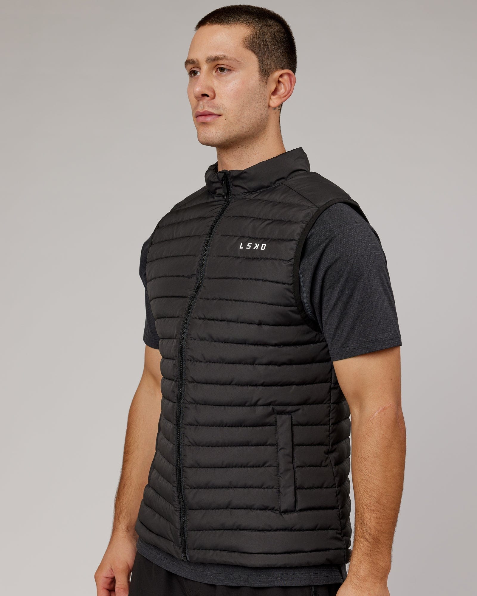 Model wearing Uplift Puffer Vest - Black Fade