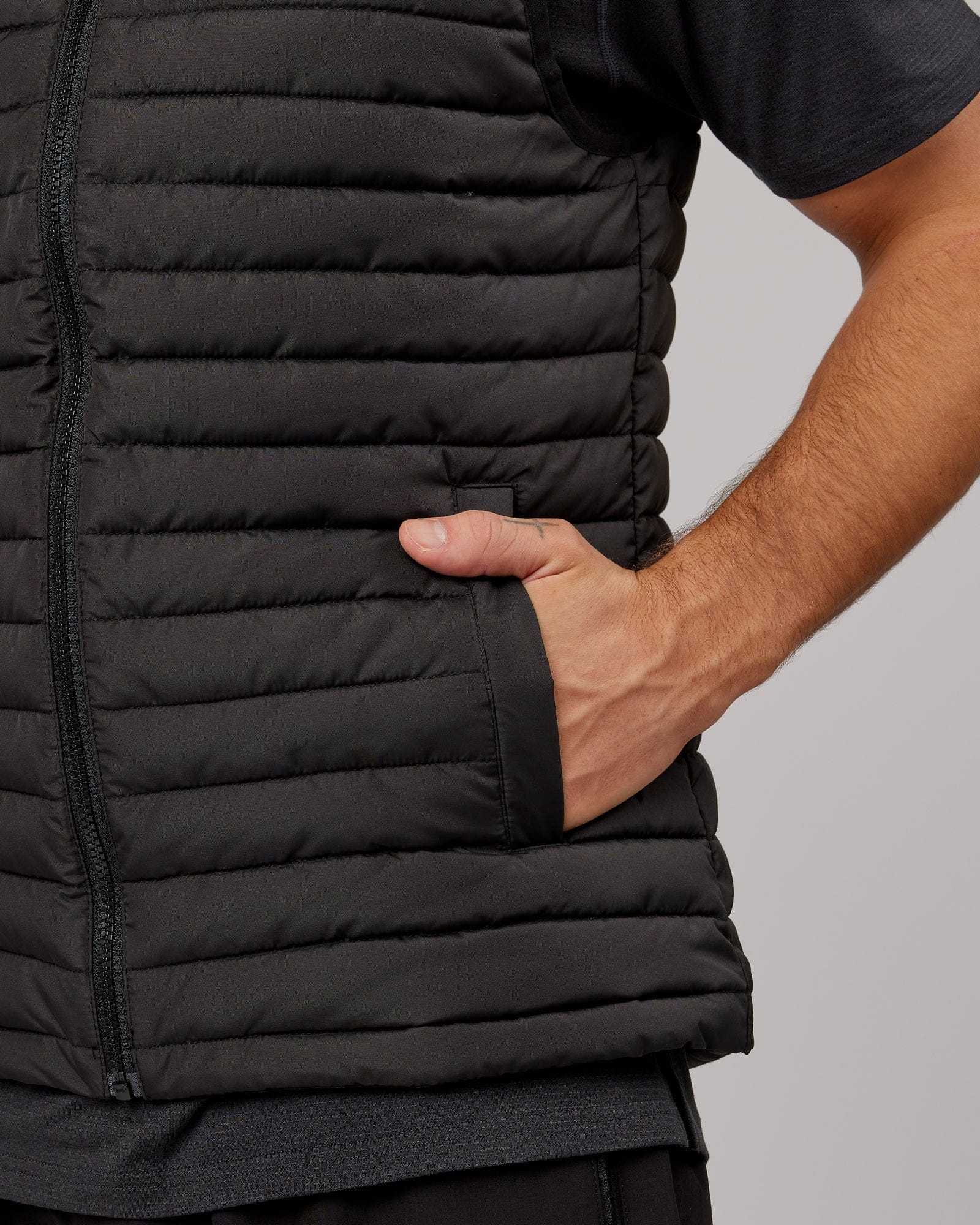 Model wearing Uplift Puffer Vest - Black Fade