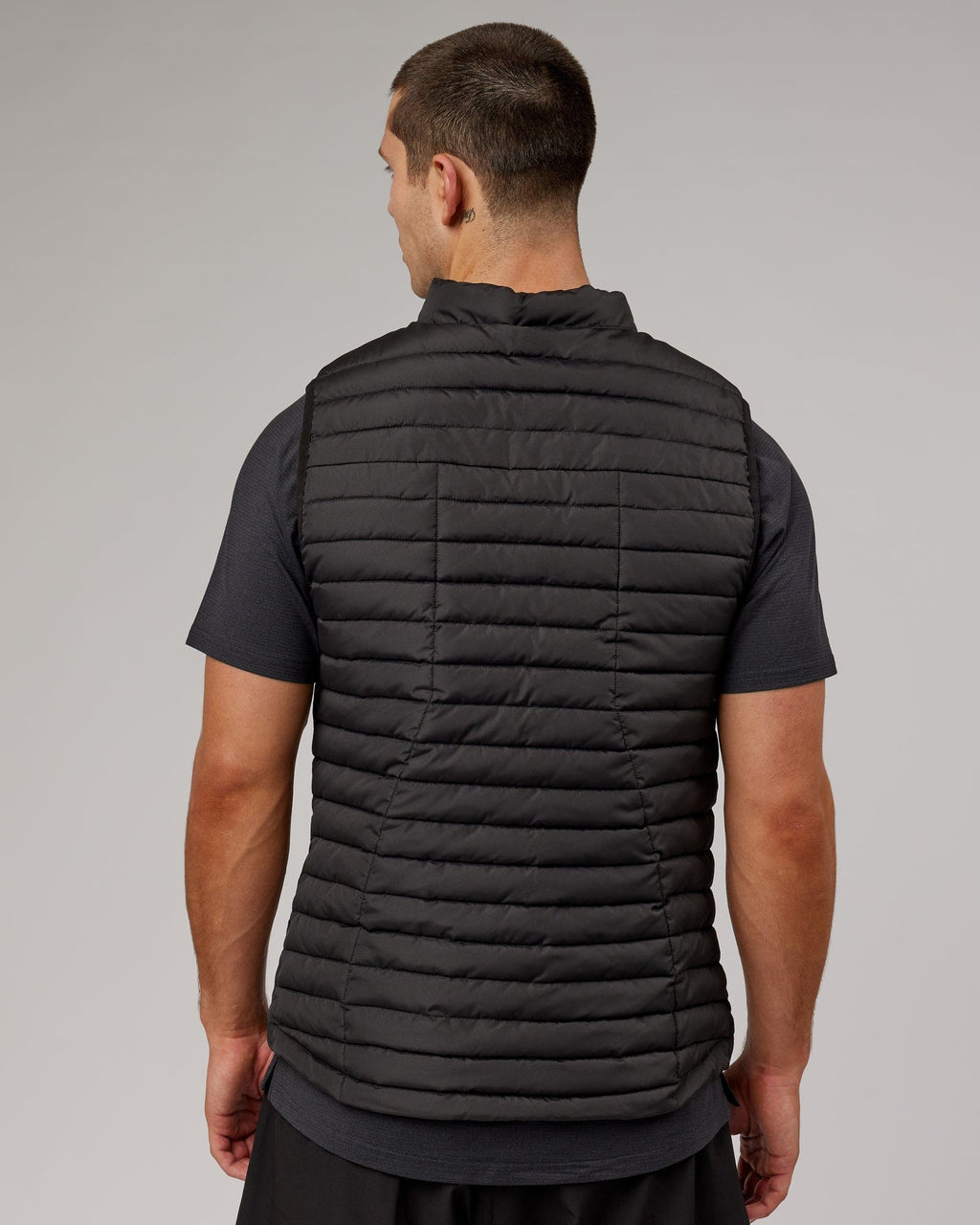Model wearing Uplift Puffer Vest - Black Fade