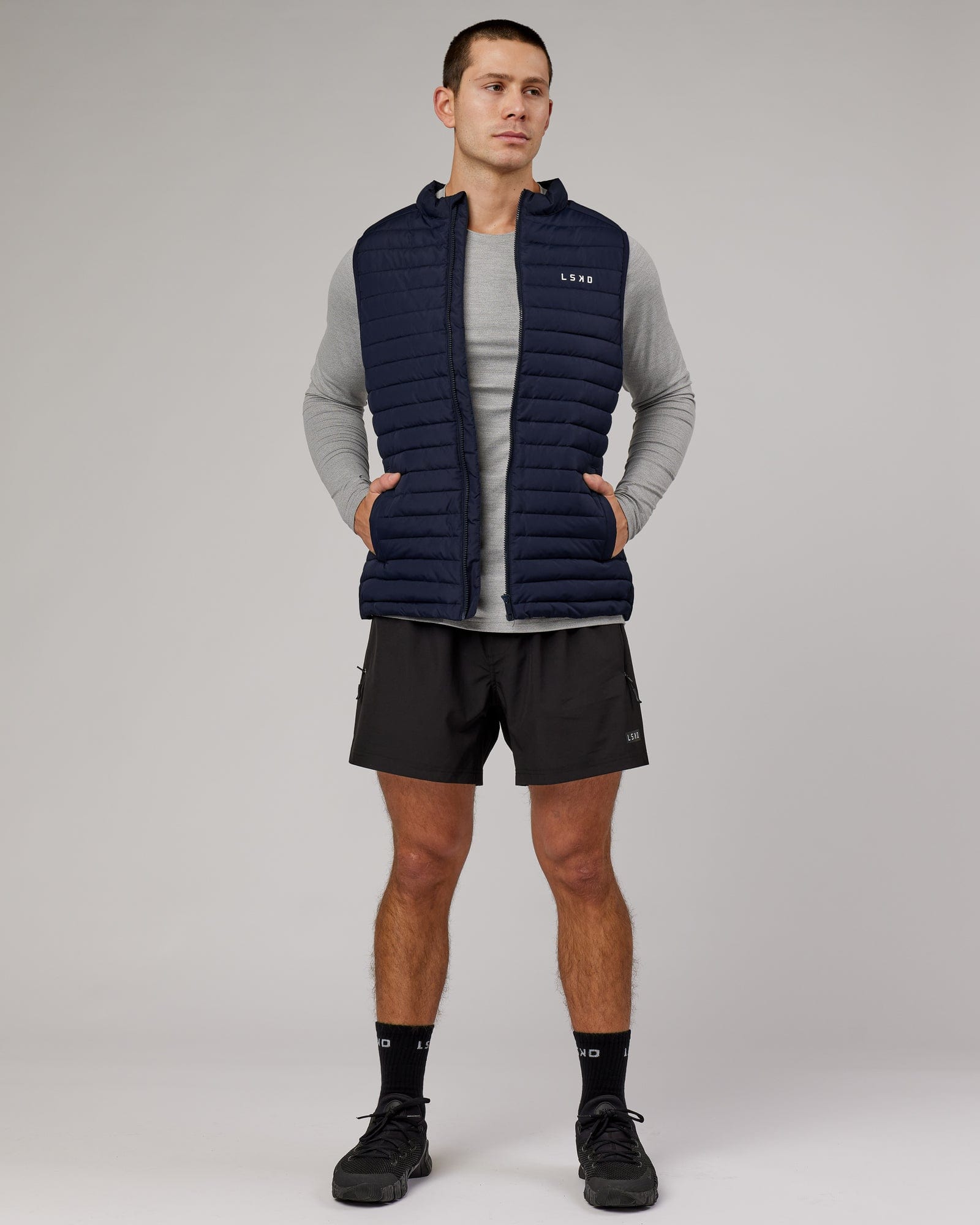 Model wearing Uplift Puffer Vest - Navy