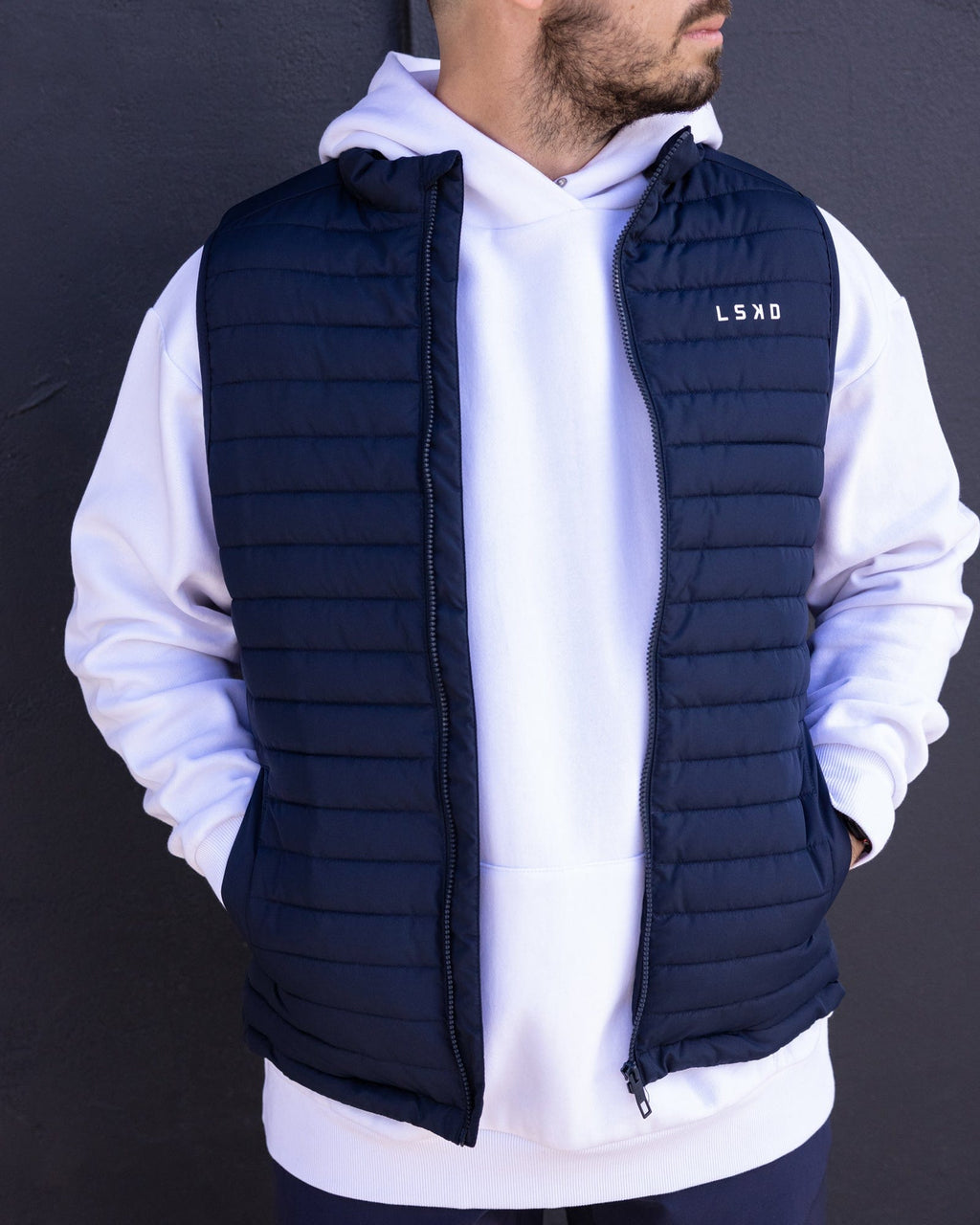Model wearing Uplift Puffer Vest - Navy
