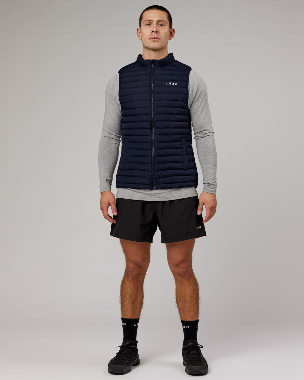 Model wearing Uplift Puffer Vest - Navy